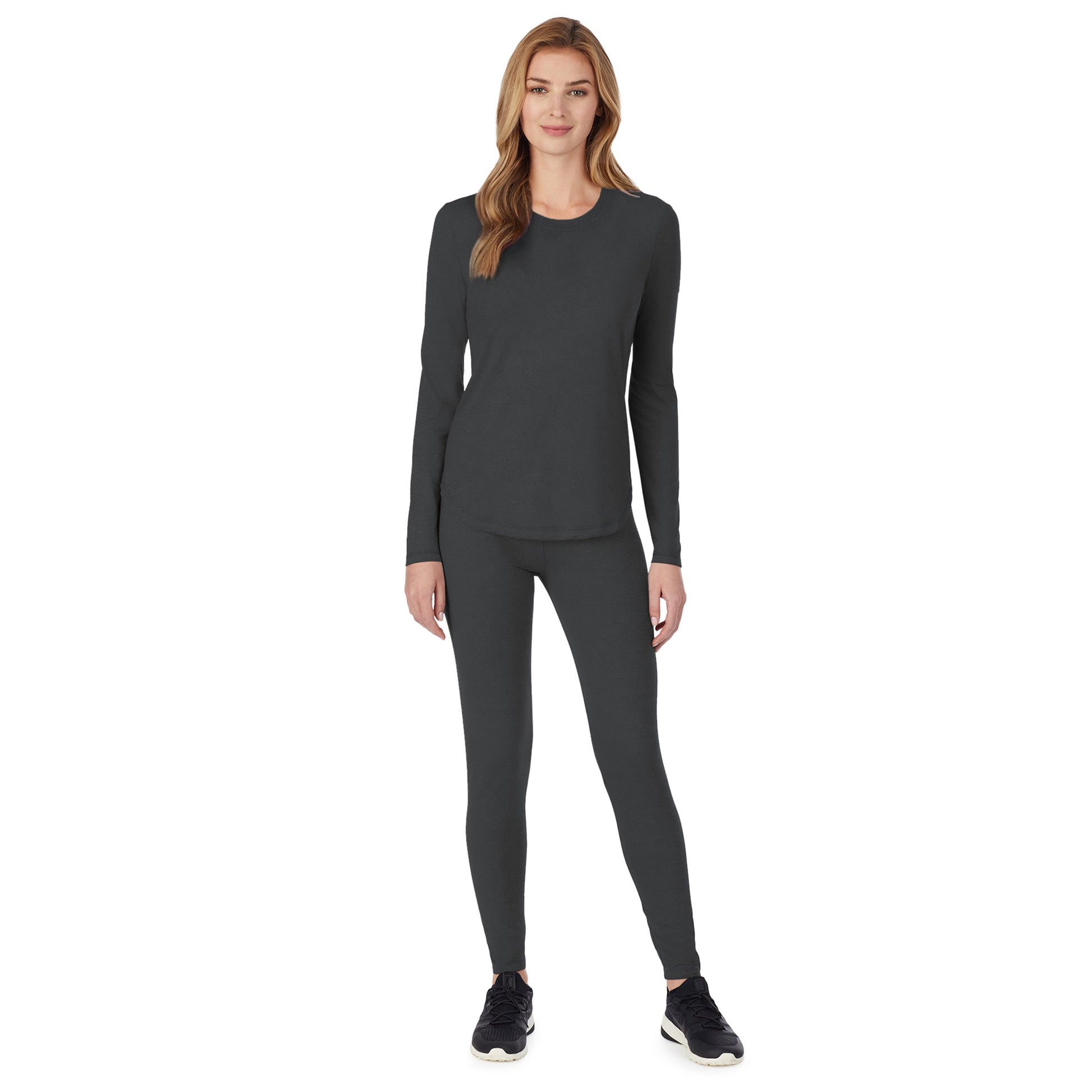 A lady wearing charcoal grey long sleeve underscrub crew neck to prtite.