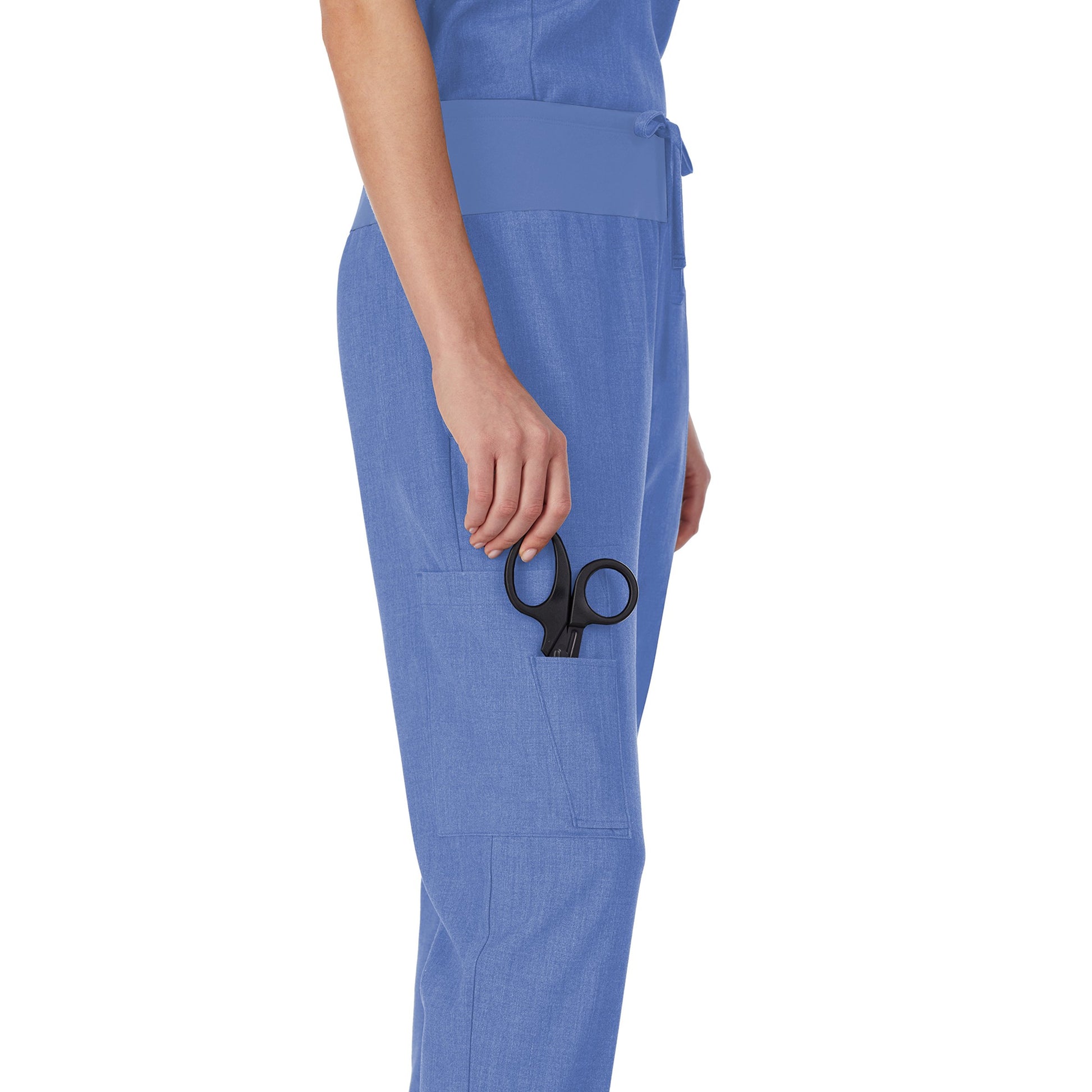 A lady wearing ceil heather scrub jogger pant petite.