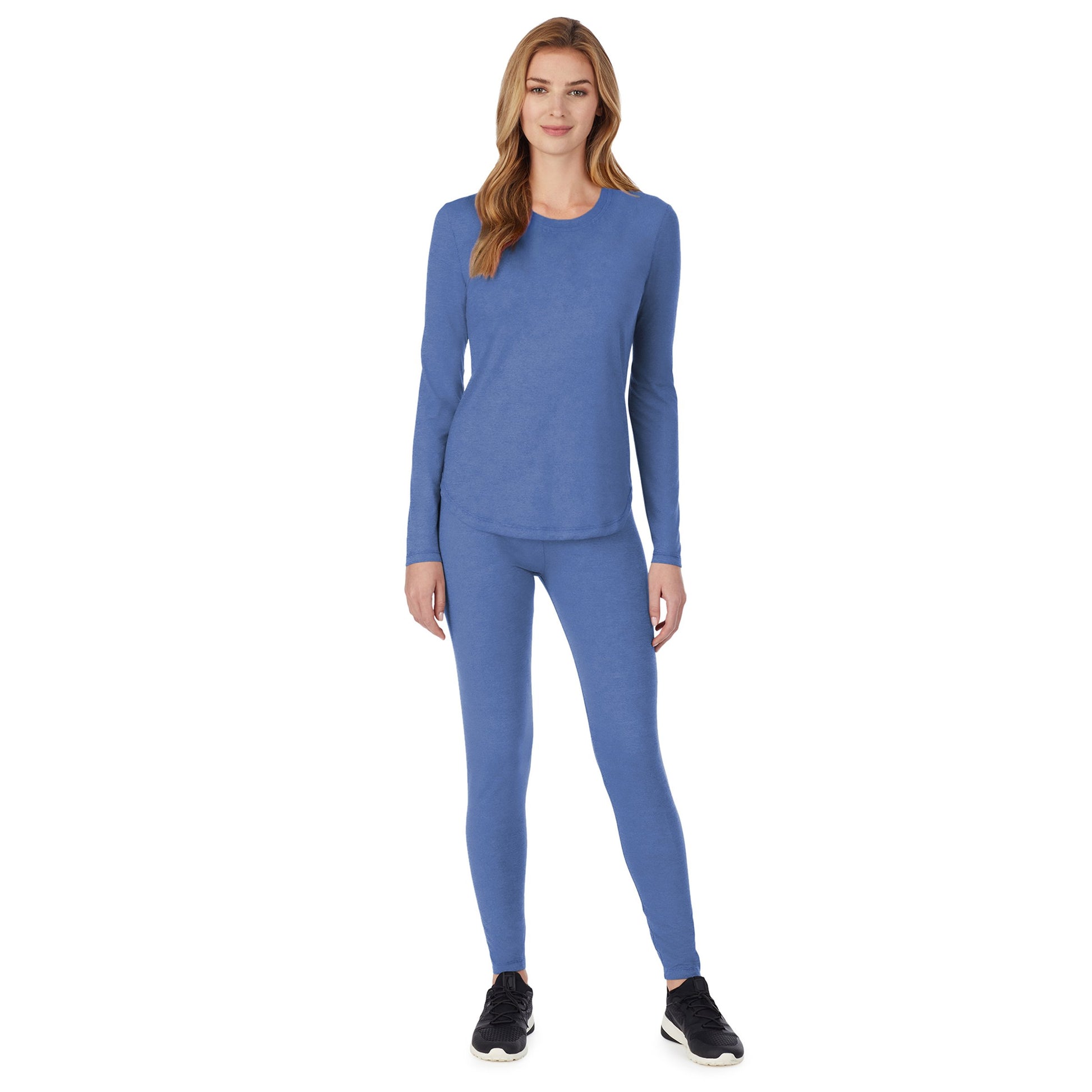 A lady wearing a ceil long sleeve underscrub crew neck top.
