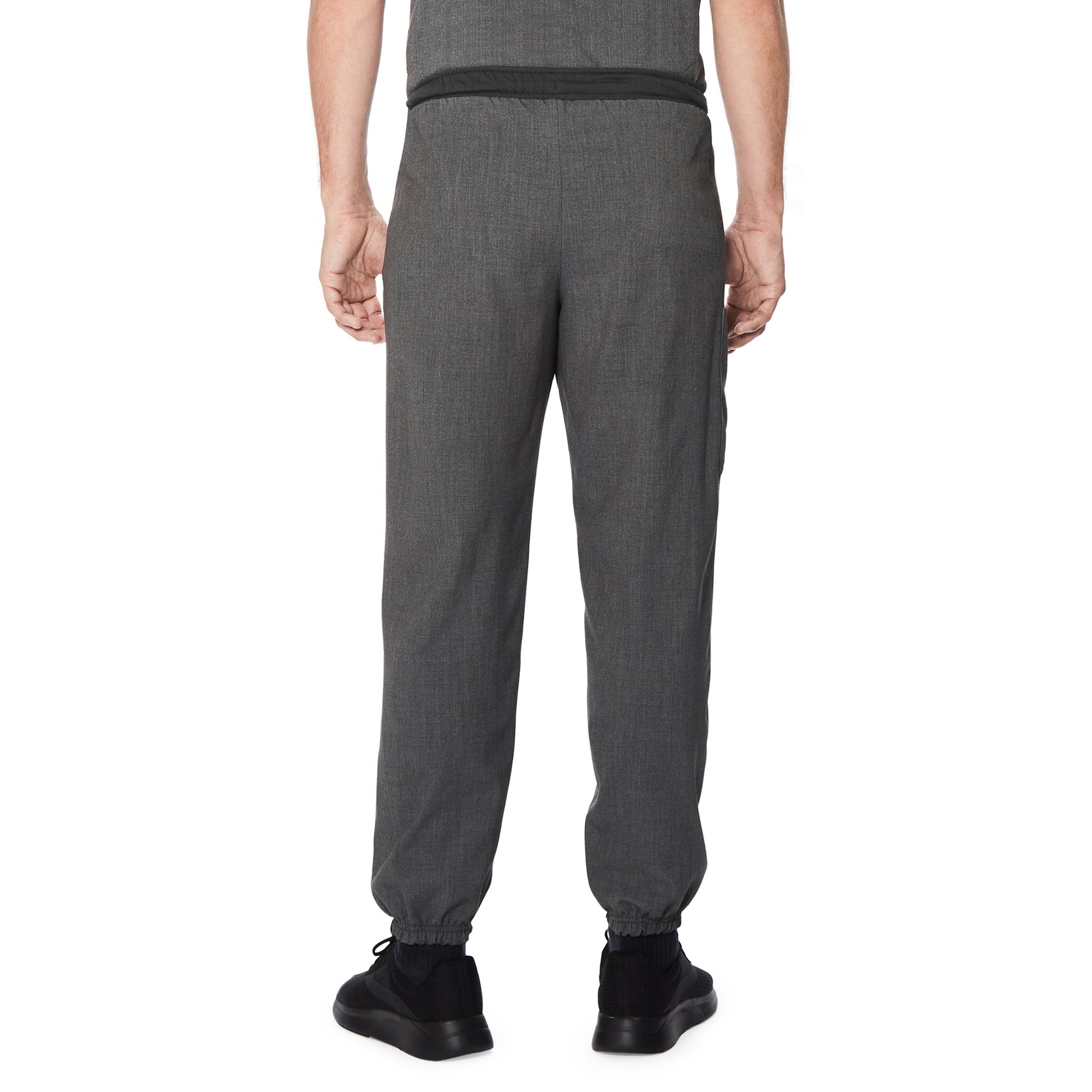 A man wearing a charcoal heather scrub jogger pant.