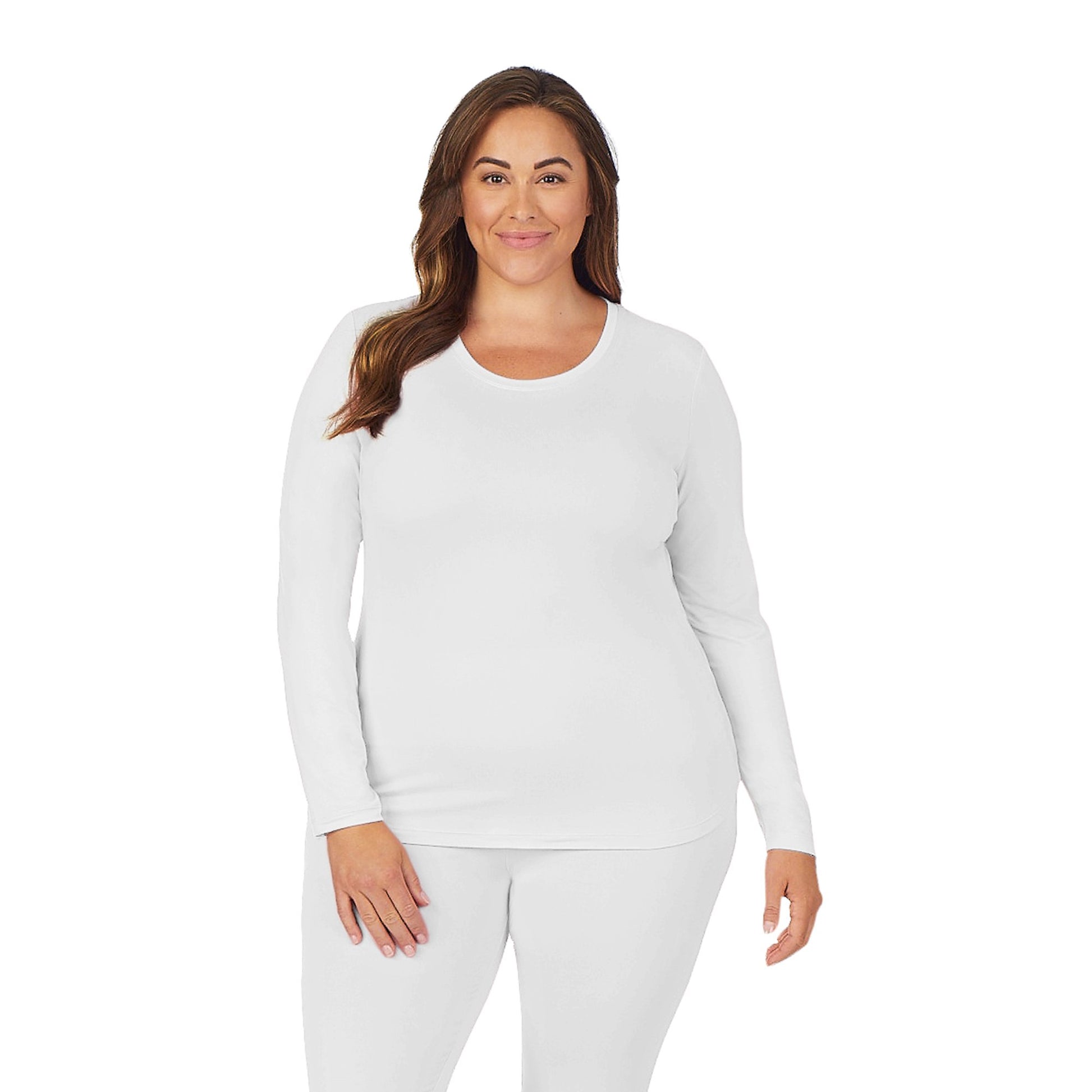 A lady wearing white long sleeve underscrub crew neck top plus.