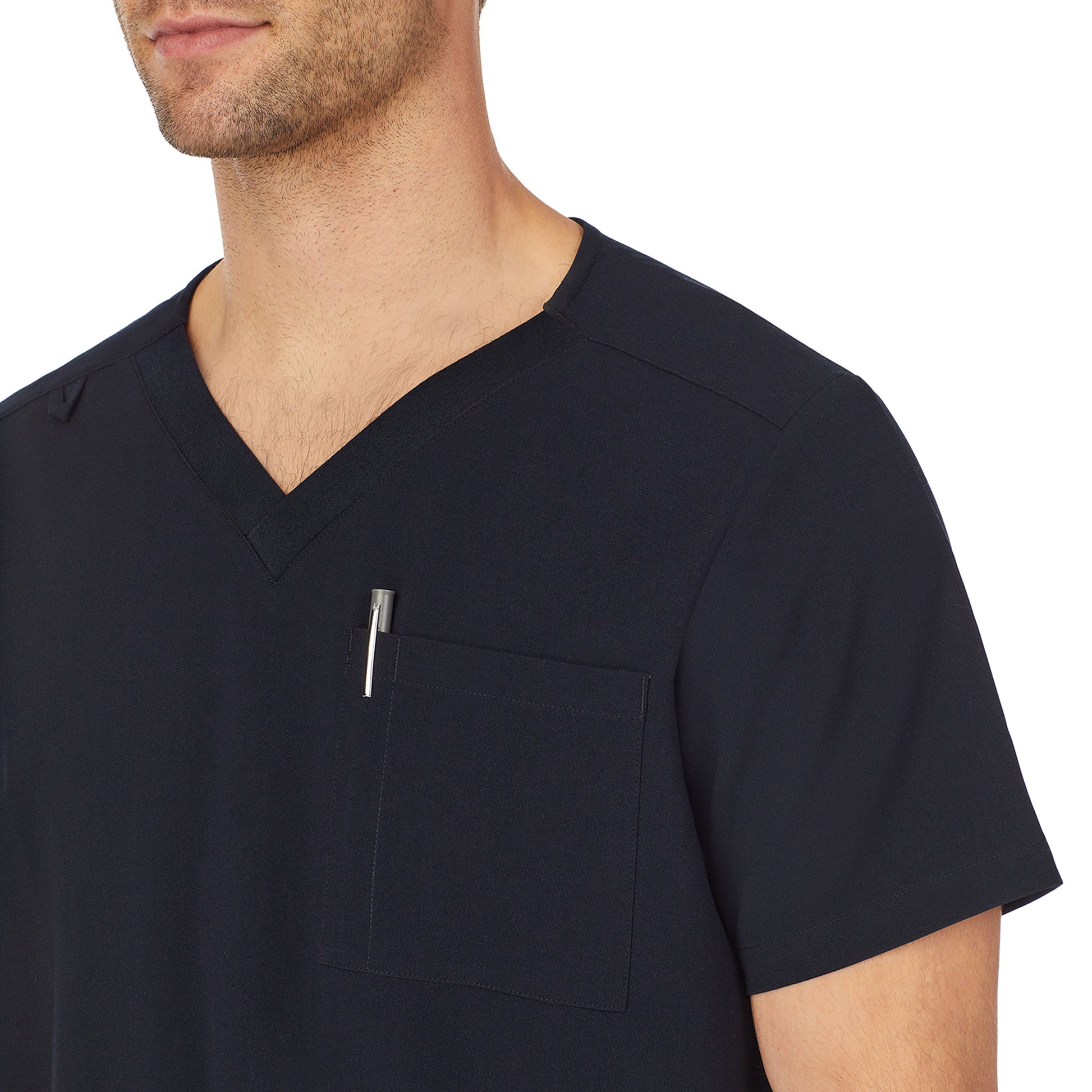 A man wearing black mens scrub v-neck top with chest pocket.