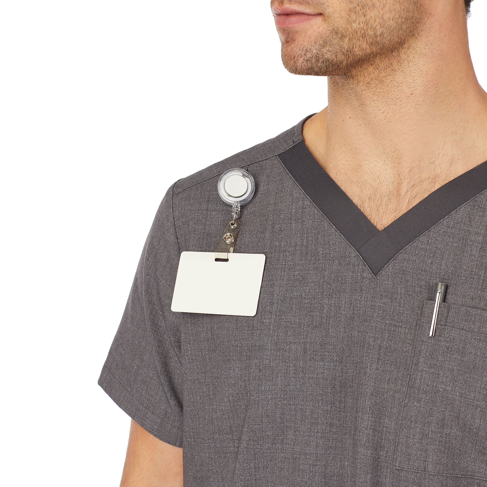 A man wearing charcoal heather mens scrub v-neck top with chest pocket.