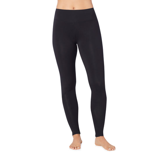 A lady wearing black high waist legging petite.