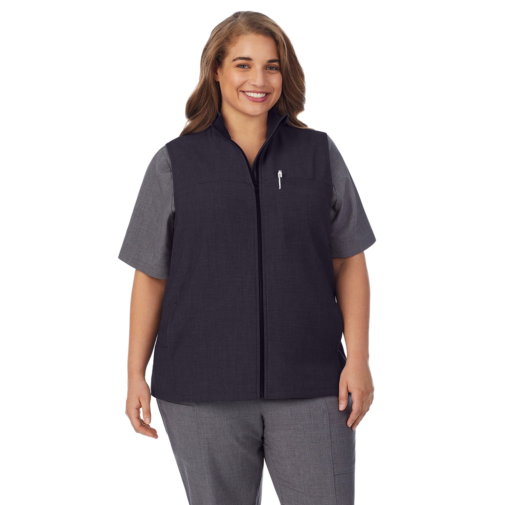 A lady wearing black scrub vest plus.