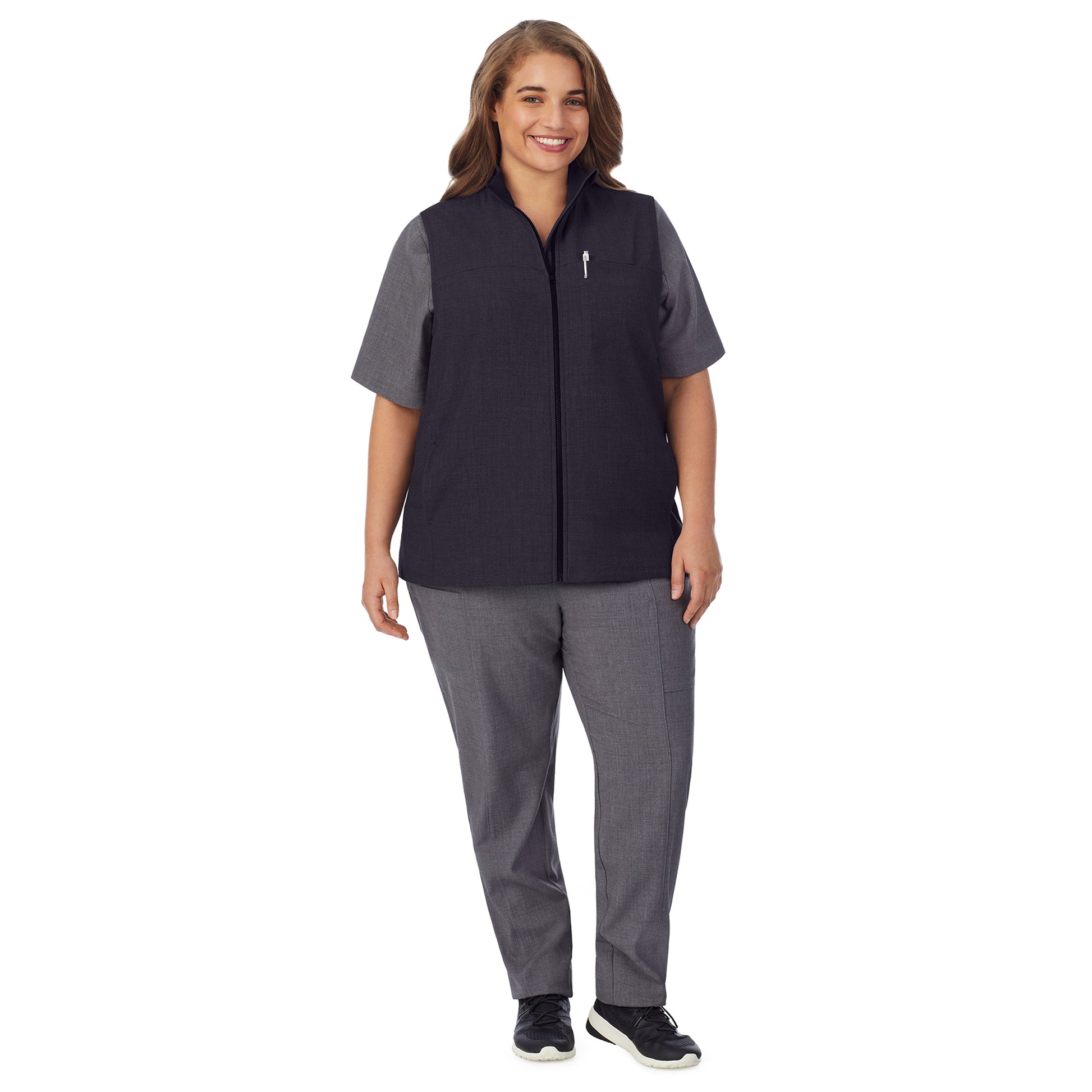 A lady wearing black scrub vest plus.