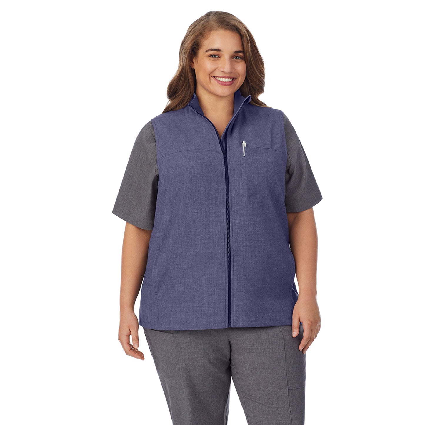 Navy Heather;Model is wearing size 1X. She is 5’7”, Bust 42.5”, Waist 34.5”, Hips 46”.@ A lady wearing navy heather scrub vest plus.