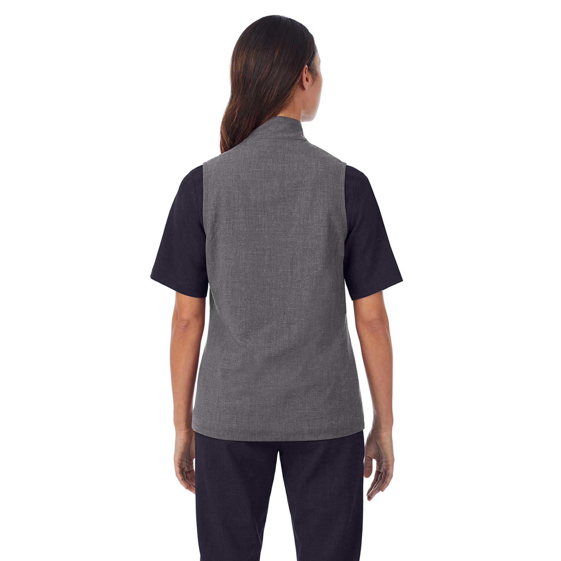 A lady wearing charcoal heather scrub vest.