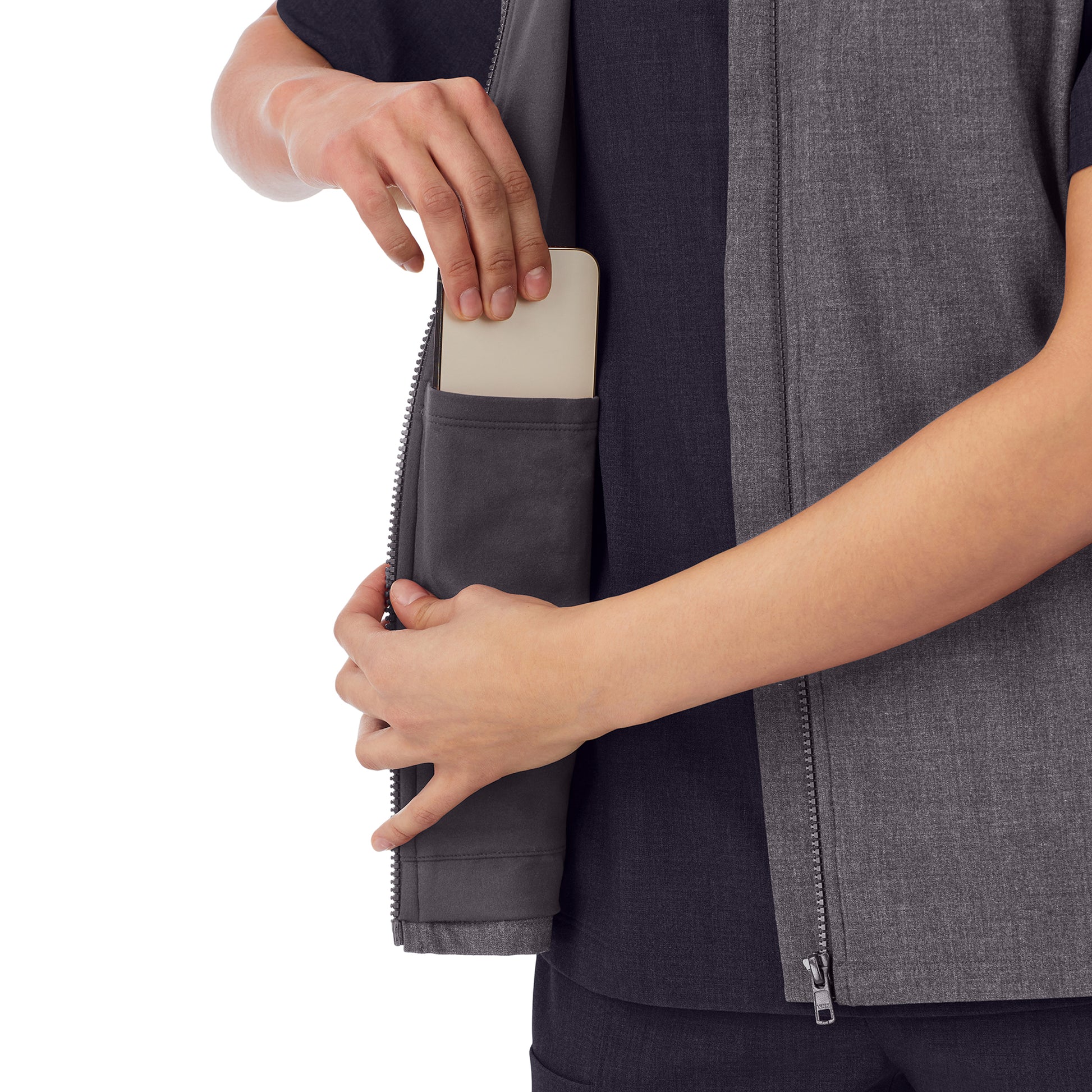 A lady wearing charcoal heather scrub vest.