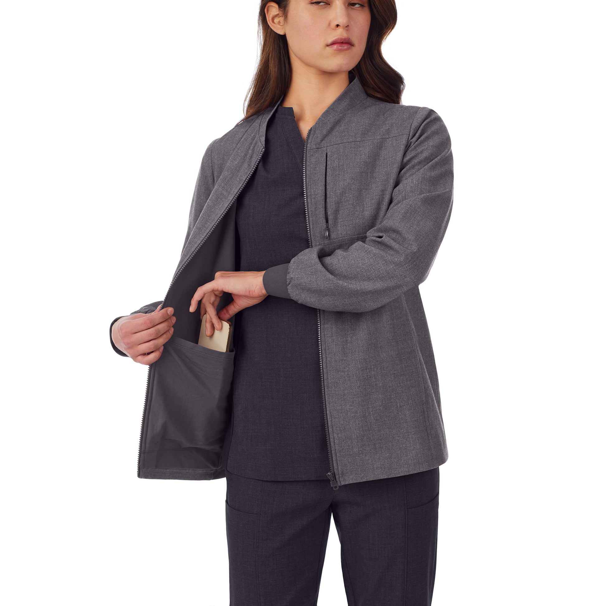 A lady wearing grey scrub jacket