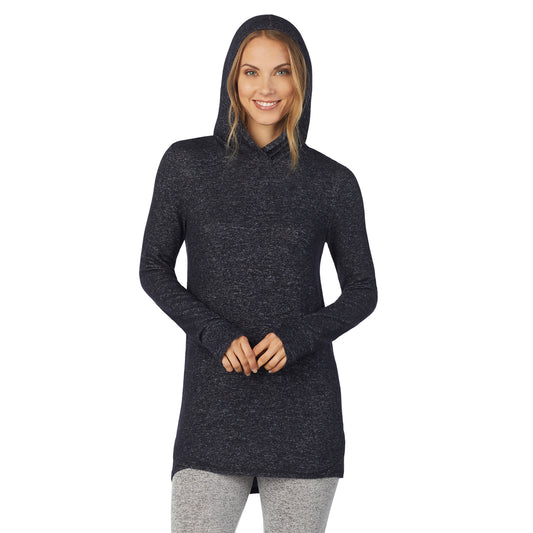 A lady wearing a marled dark charcoal long sleeve tunic hoodie.
