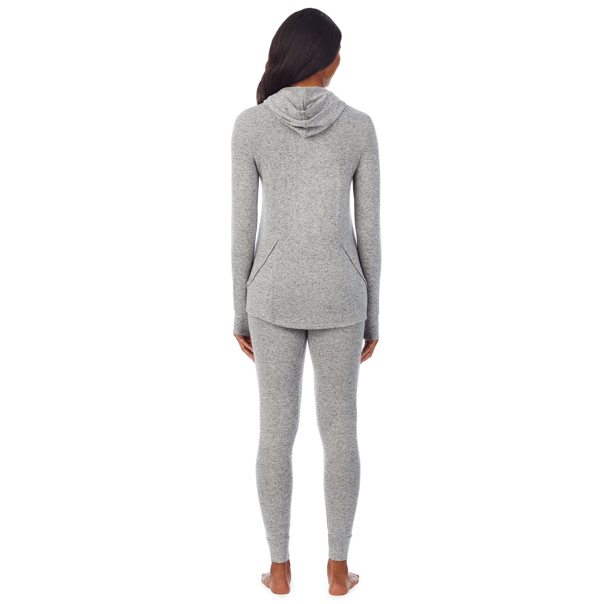 A lady wearing a marled grey long sleeve tunic hoodie.