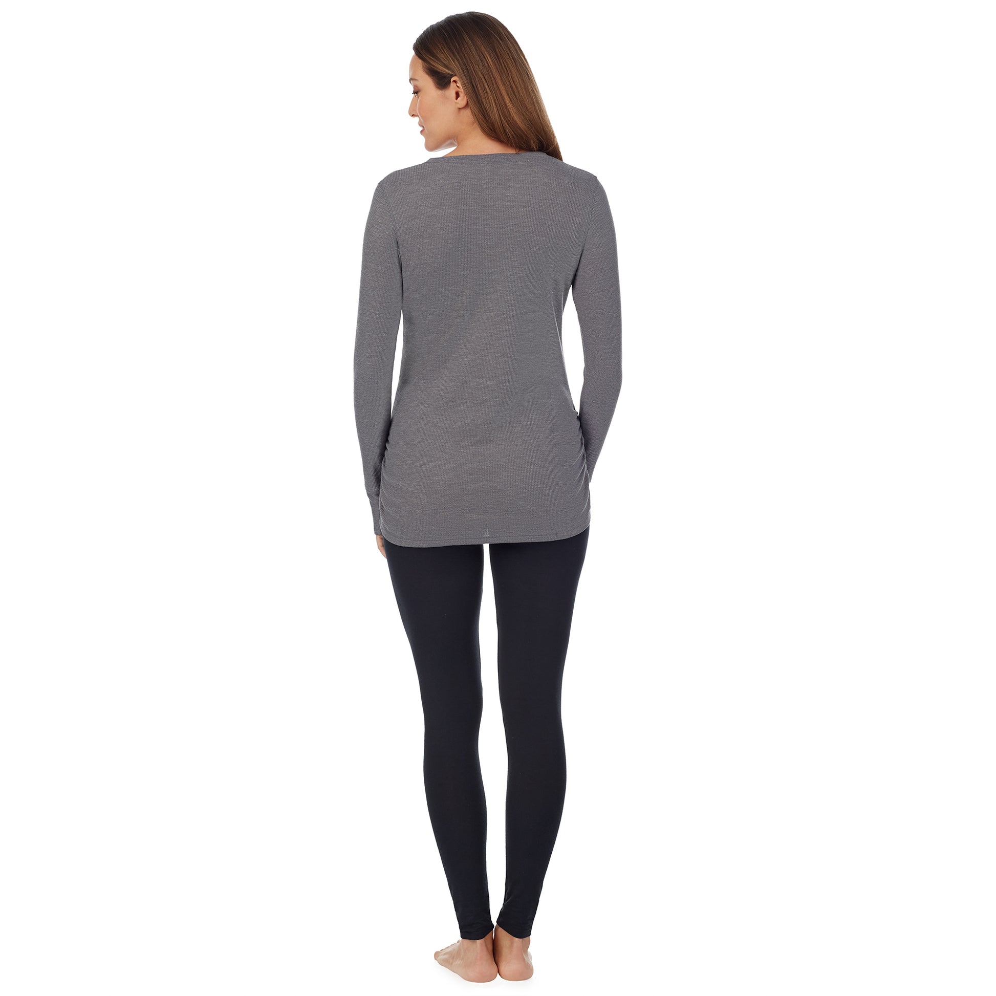 A lady wearing a stone grey heather long sleeve split V-Neck henley. #Model is wearing a maternity bump.