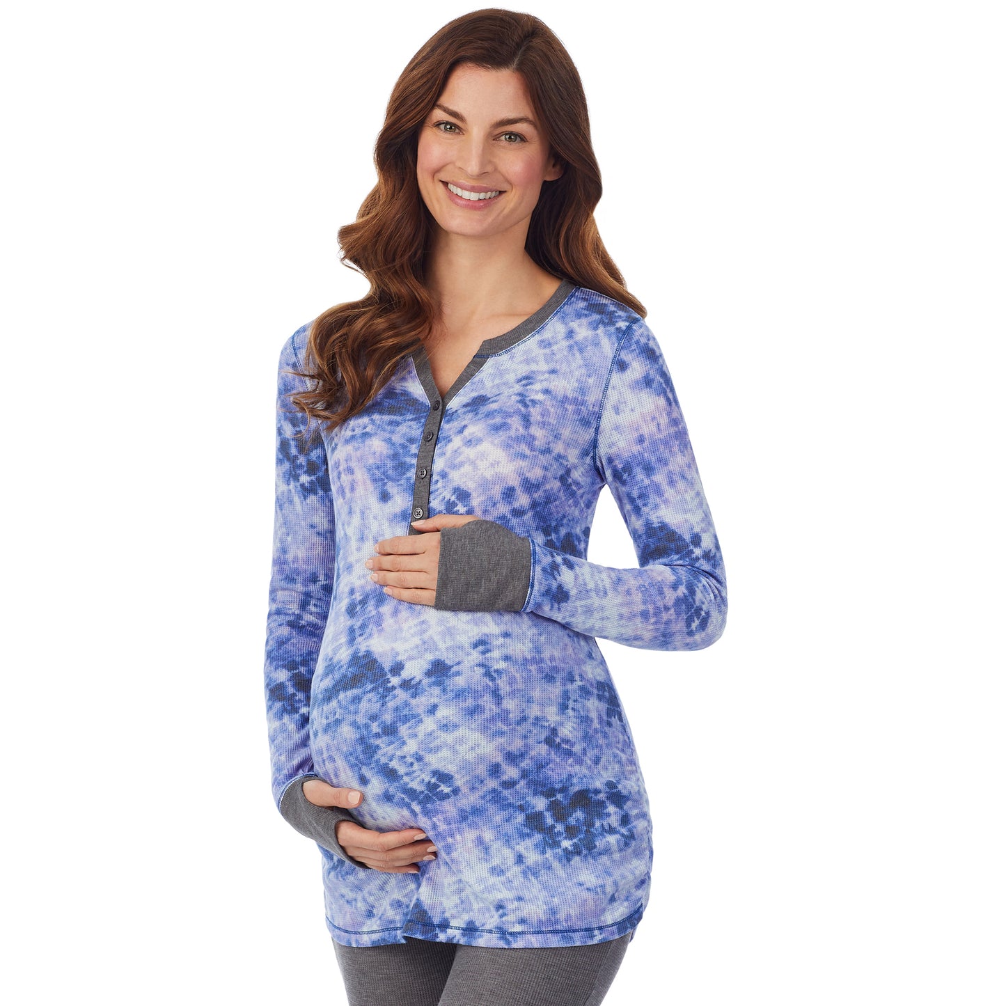 Blue Tie Dye; Model is wearing size S. She is 5’9”, Bust 34”, Waist 24.5”, Hips 36.5”. @A lady wearing a blue tie dye long sleeve split V-Neck henley. #Model is wearing a maternity bump.