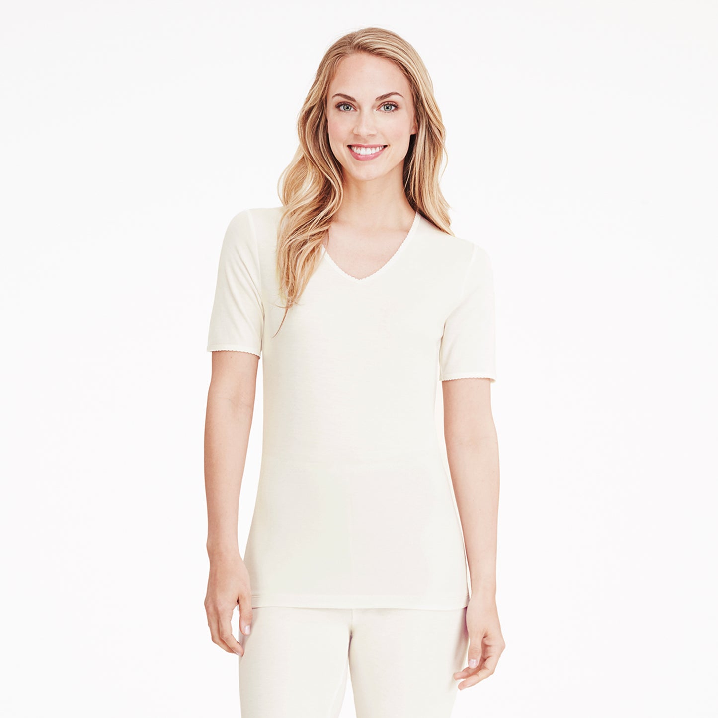 Ivory; Model is wearing size S. She is 5’9”, Bust 32”, Waist 25.5”, Hips 36”. @A lady wearing a ivory lace edge short sleeve V-Neck.