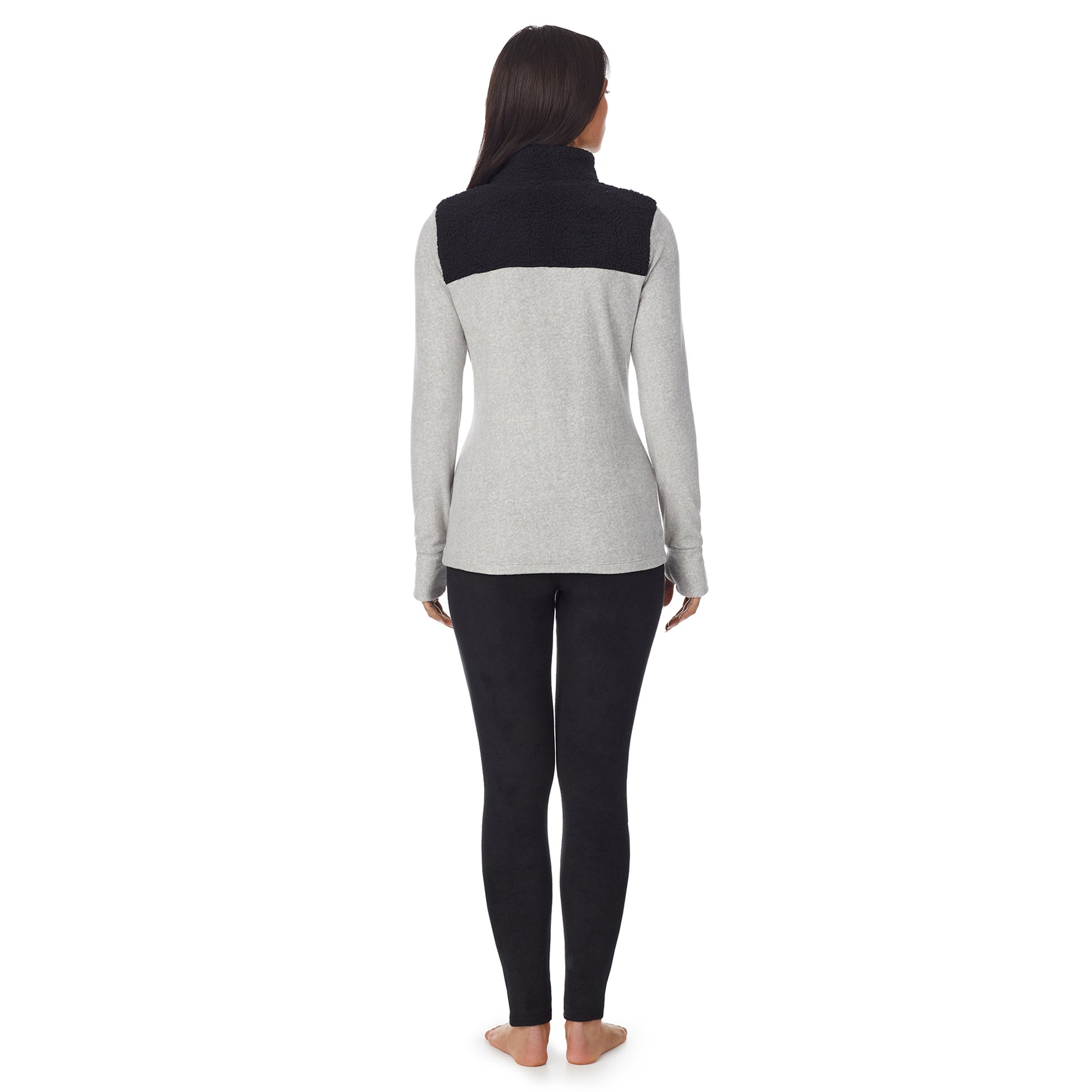 a lady wearing grey long sleeve mixed media mock
