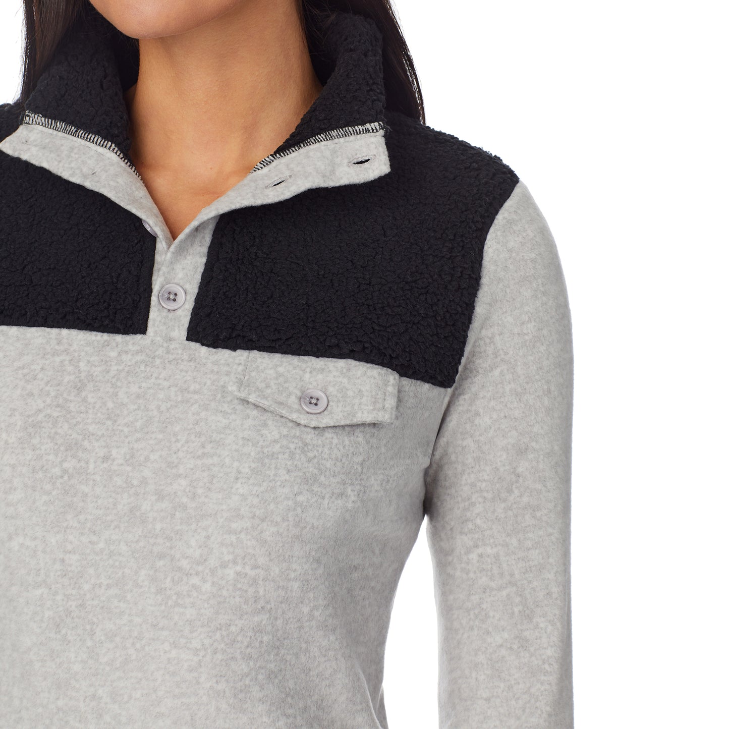 Light Grey Heather; Model is wearing size S. She is 5'8.5", Bust 32", Waist 25", Hips 36".@upper body of a lady wearing grey long sleeve mixed media mock !59% Polyester, 35% Recycled Polyester, 6% Spandex!
