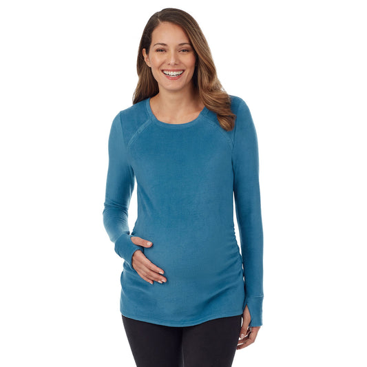 A lady wearing long sleeve fleecewear with stretch maternity snap front crew.#Model is wearing a maternity bump.