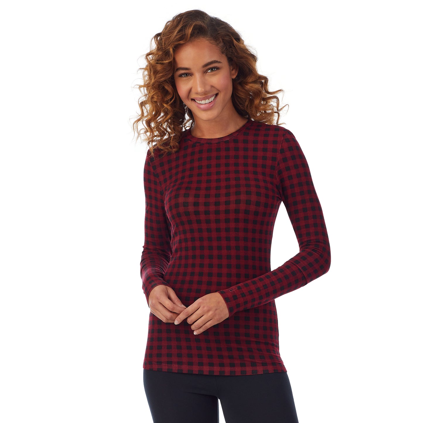 Rhubarb Buffalo; Model is wearing size S. She is 5’9”, Bust 34”, Waist 23”, Hips 35”. @A lady wearing a red buffalo long sleeve stretch crew.
