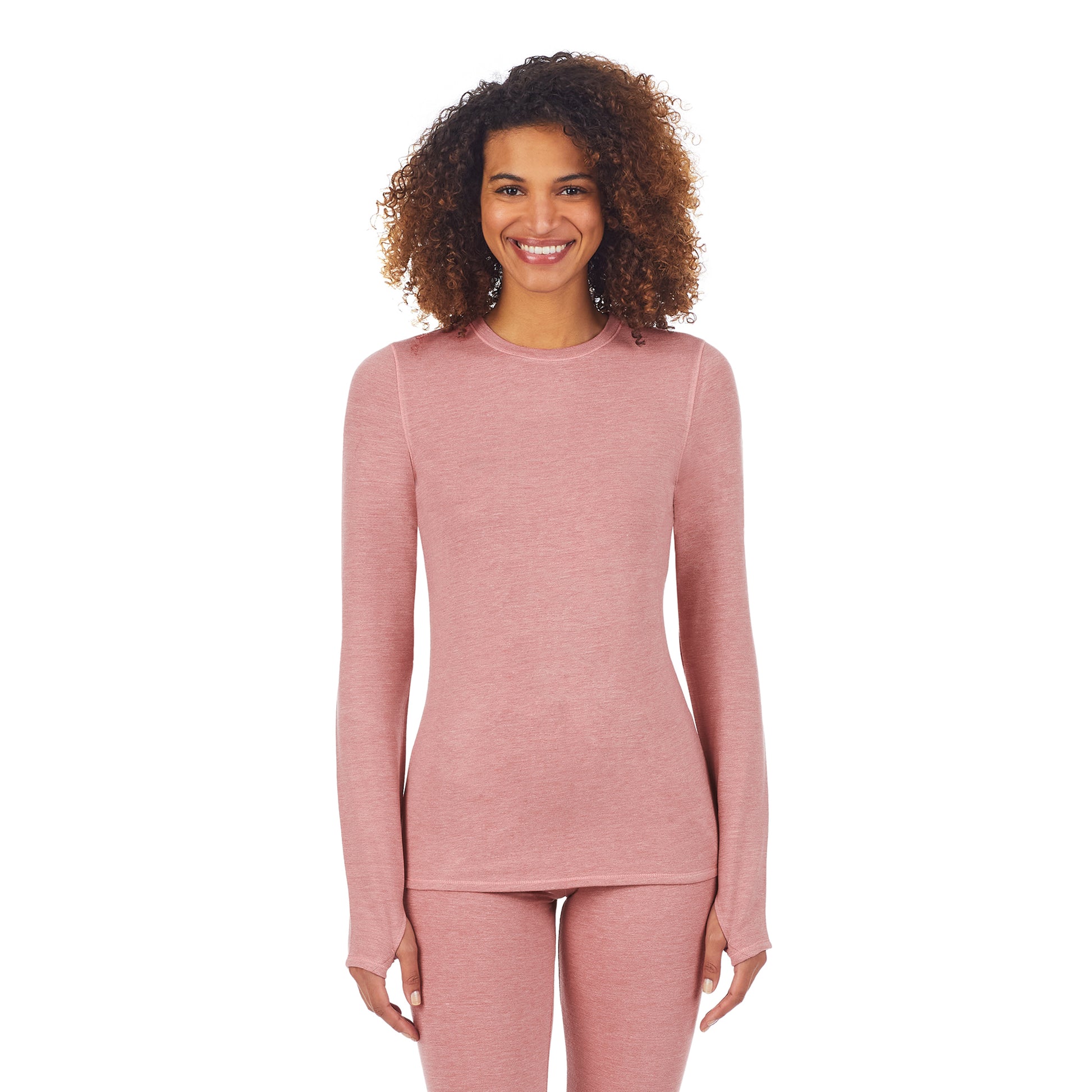 A lady wearing a mink taupe heather long sleeve crew.