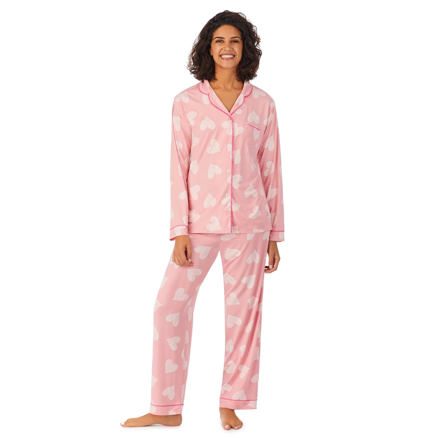 Pink Ground Hearts; Model is wearing size S. She is 5’9”, Bust 32”, Waist 24”, Hips 34.5”. @A lady wearing a pink long sleeve pajama set with white.
