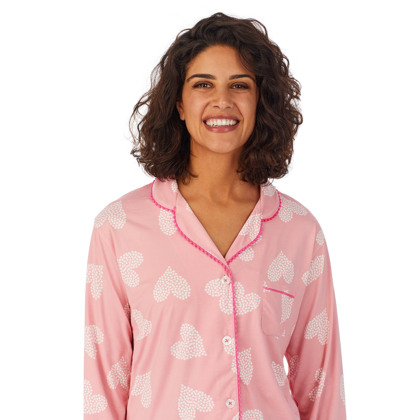 Pink Ground Hearts; Model is wearing size S. She is 5’9”, Bust 32”, Waist 24”, Hips 34.5”. @A lady wearing a pink long sleeve pajama set with white.
