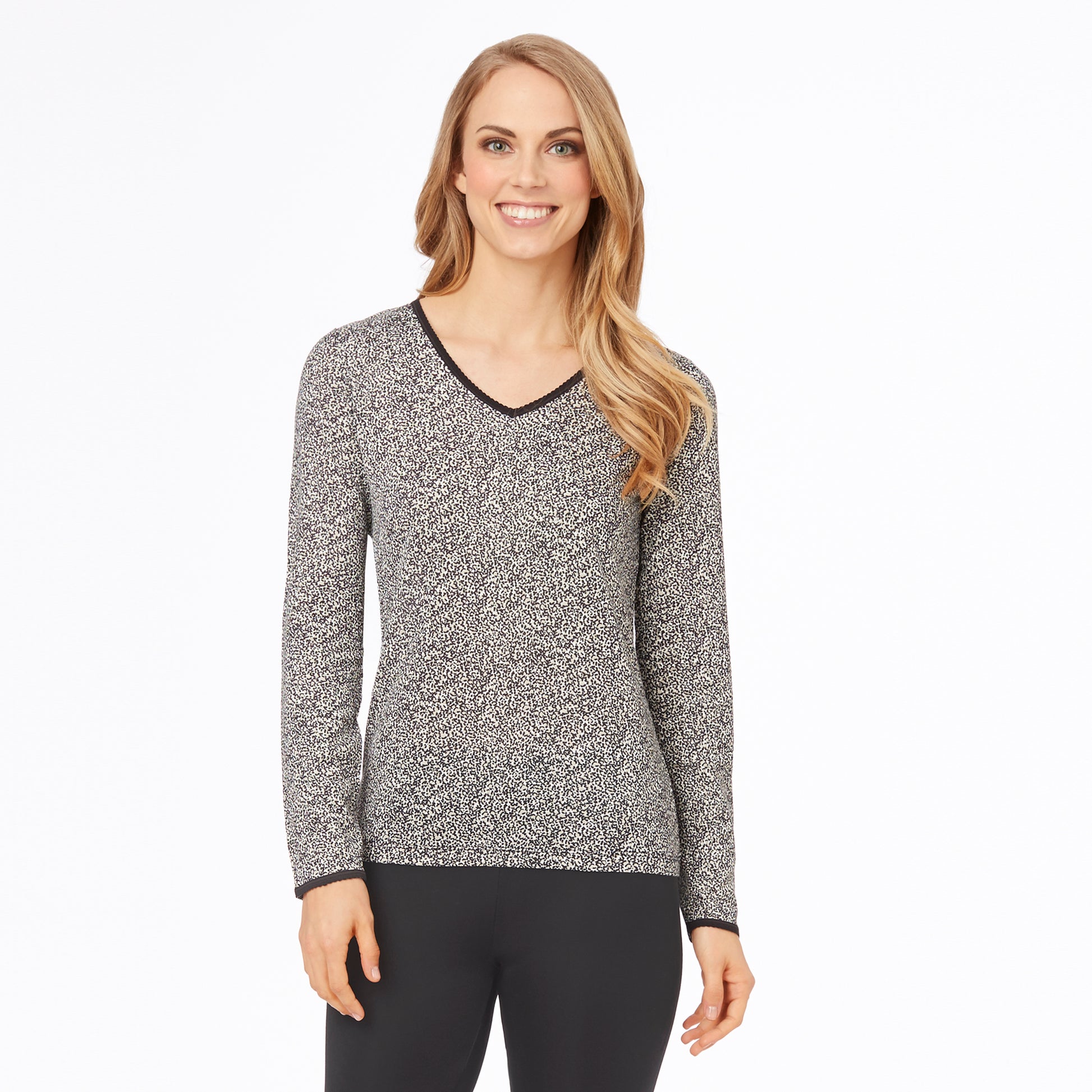 A lady wearing a cheetah long sleeve lace edge V-Neck.
