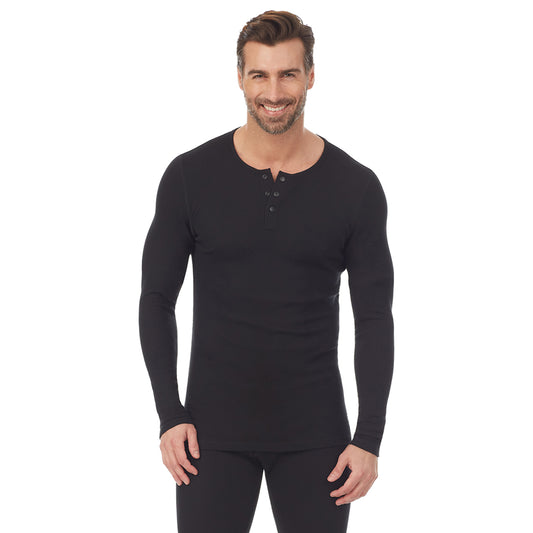 A man wearing a black long sleeve henley t-shirt.