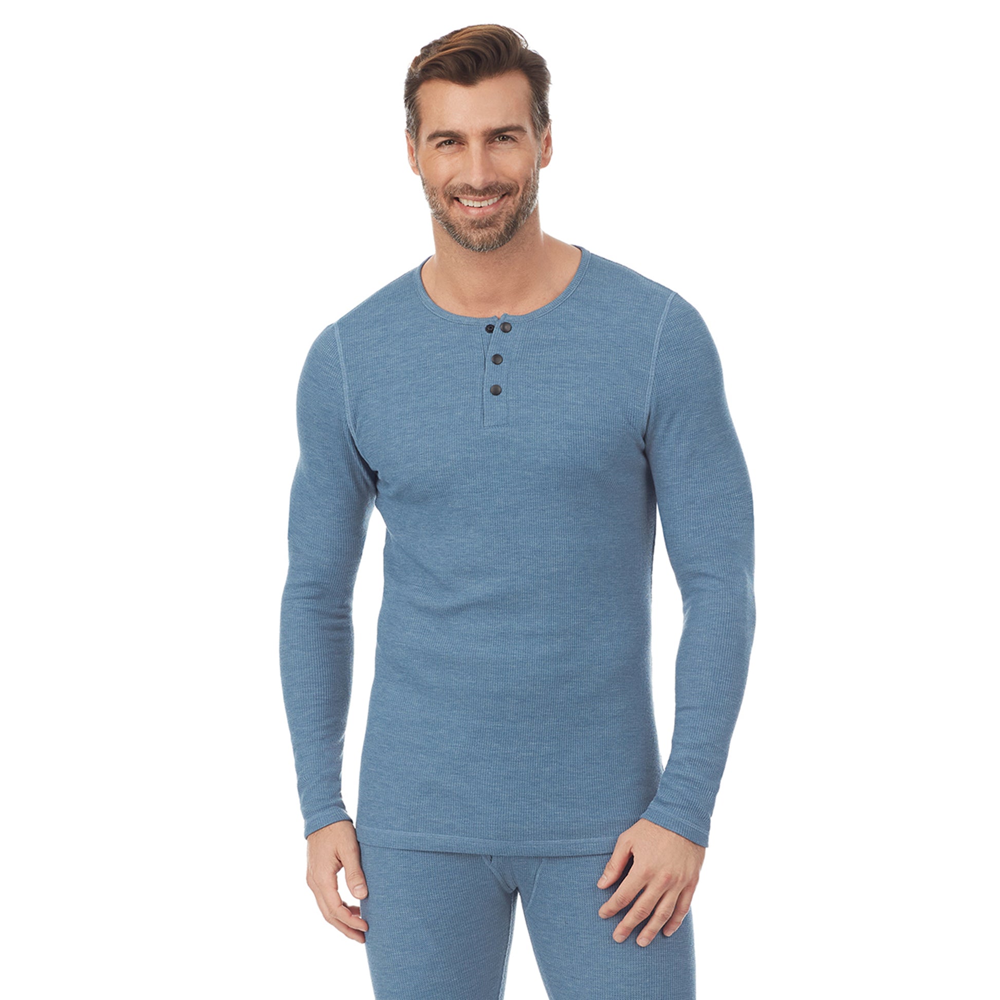 A man wearing a blue heather long sleeve henley t-shirt.