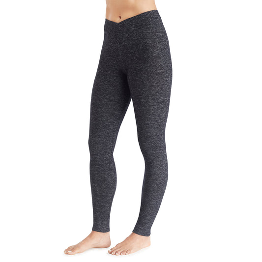A lady wearing a marled dark charcoal legging.