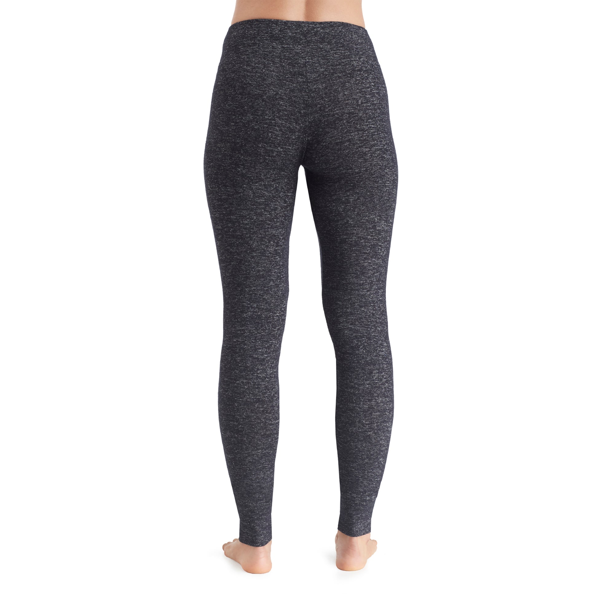 A lady wearing a marled dark charcoal legging.