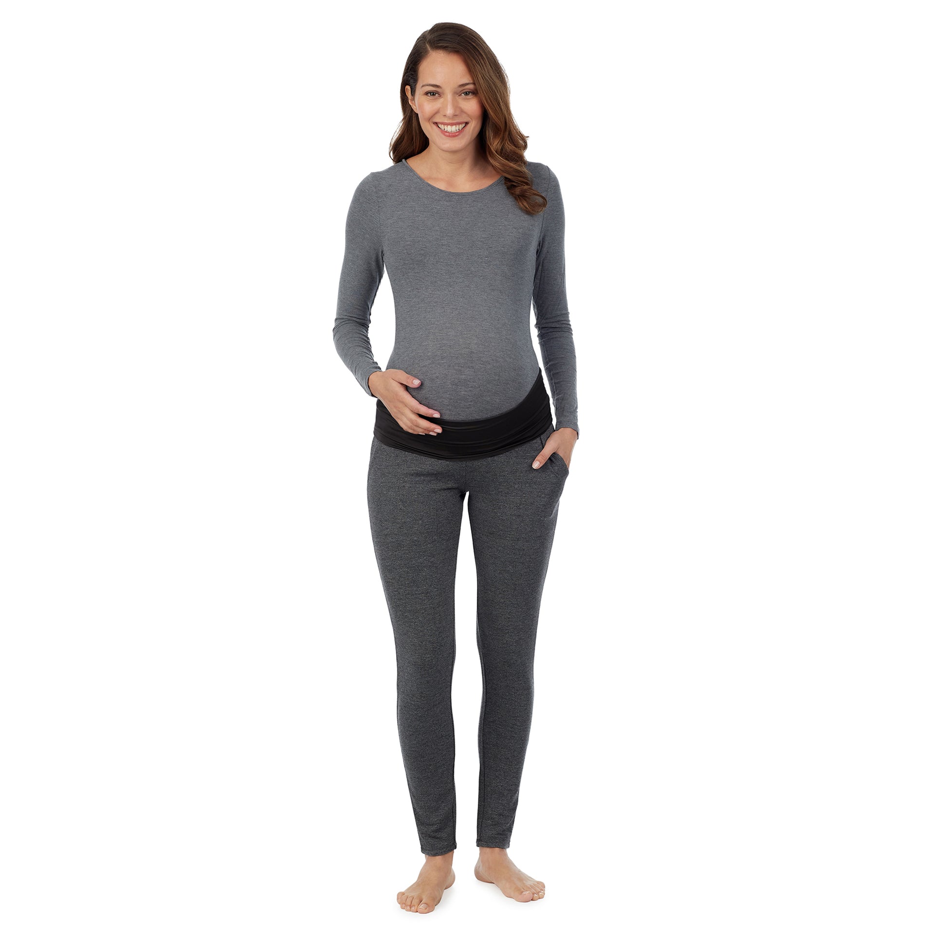 A lady wearing a charcoal heather legging. #Model is wearing a maternity bump.