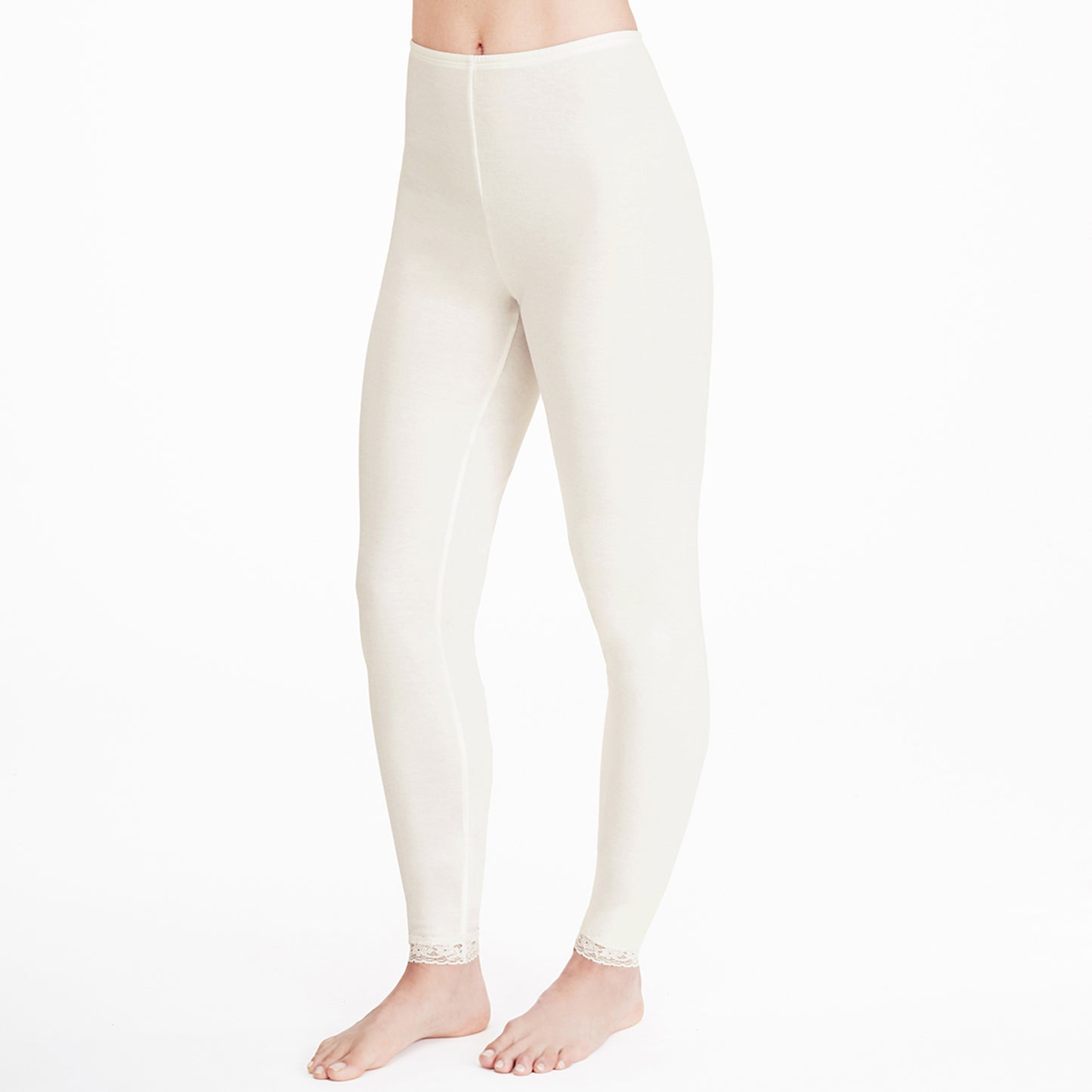 Ivory; Model is wearing size S. She is 5’9”, Bust 32”, Waist 25.5”, Hips 36”. @A lady wearing a ivory lace edge legging.