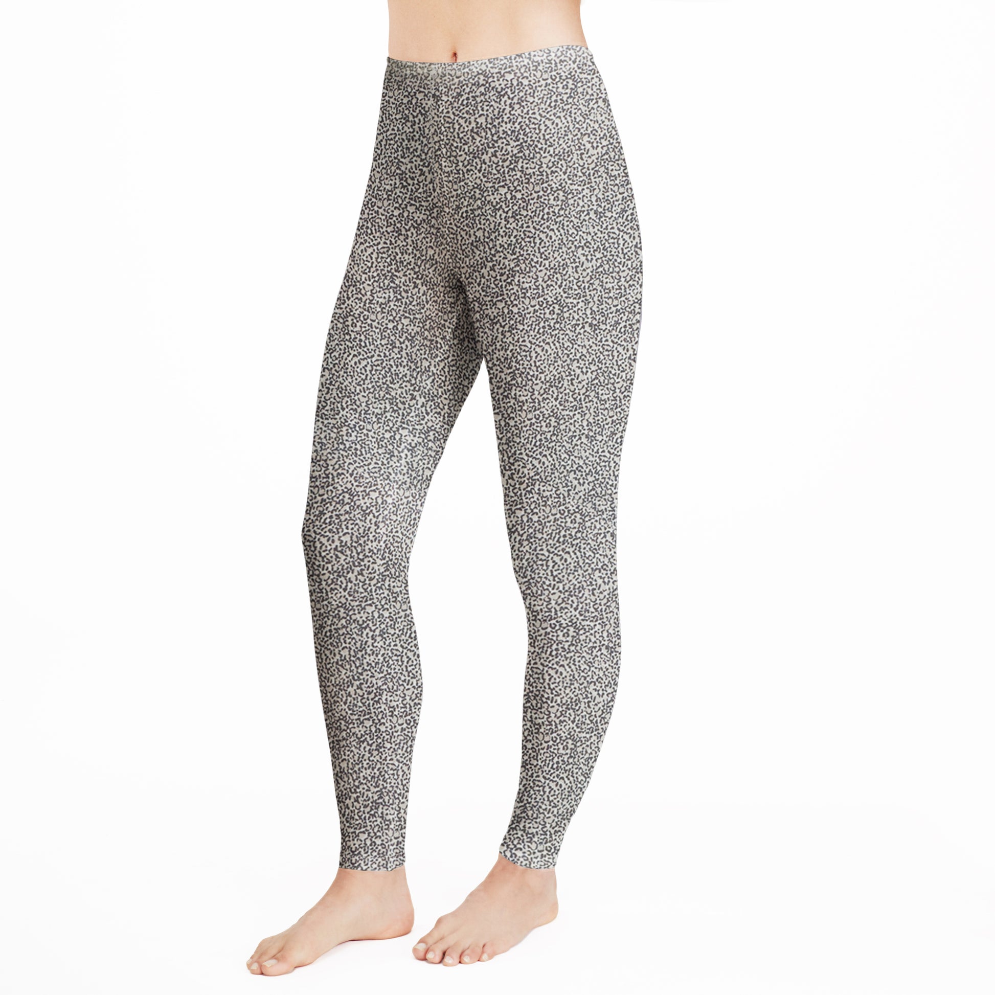 A lady wearing  a cheetah legging.