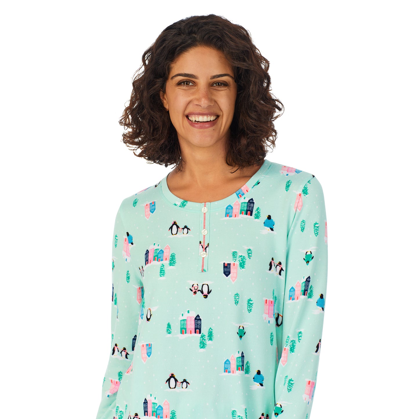 Teal Penguin; Model is wearing size S. She is 5’9”, Bust 32”, Waist 24”, Hips 34.5”. @A lady wearing a teal long sleeve pajama set with penguins pattern.