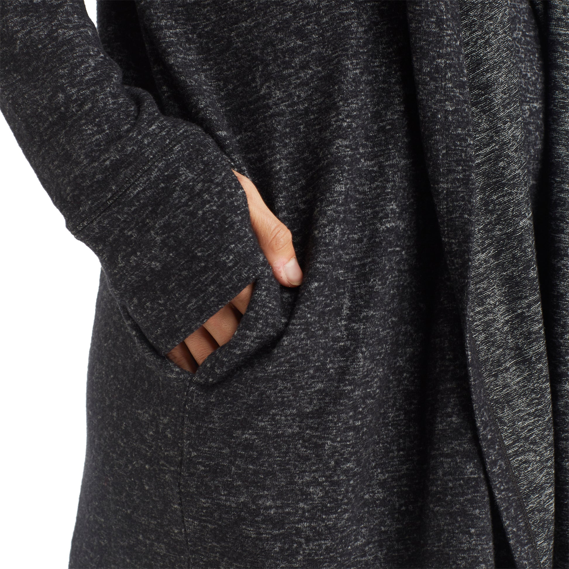 A lady wearing a marled dark charcoal long sleeve wrap.