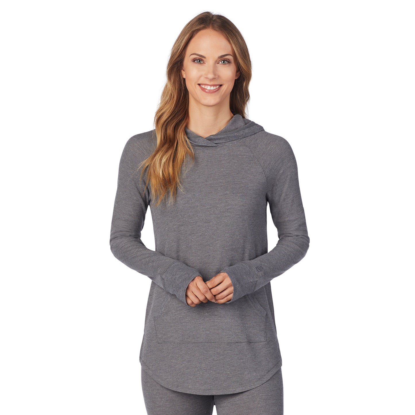 Stone Grey Heather; Model is wearing size S. She is 5’9”, Bust 32”, Waist 25.5”, Hips 36”. @A lady wearing a stone grey heather long sleeve hoodie tunic.