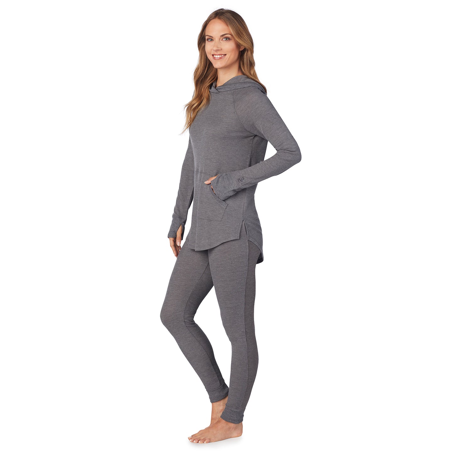 Stone Grey Heather; Model is wearing size S. She is 5’9”, Bust 32”, Waist 25.5”, Hips 36”. @ A lady wearingStretch Thermal Long Sleeve Hoodie Tunic with Stone Grey Heather print