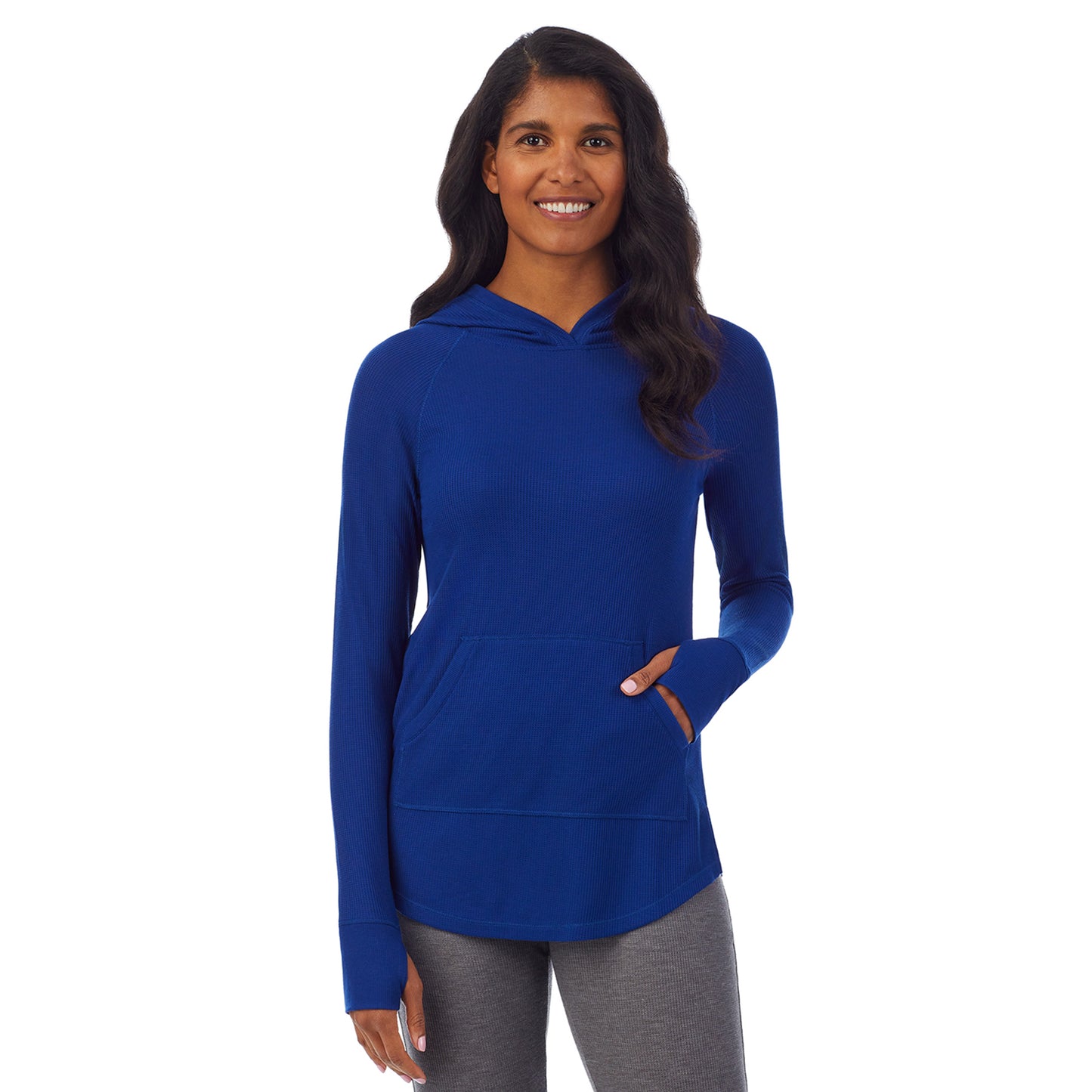 Royal Blue; Model is wearing size S. She is 5’10”, Bust 34”, Waist 24”, Hips 34”. @A lady wearing a royal blue long sleeve hoodie tunic.