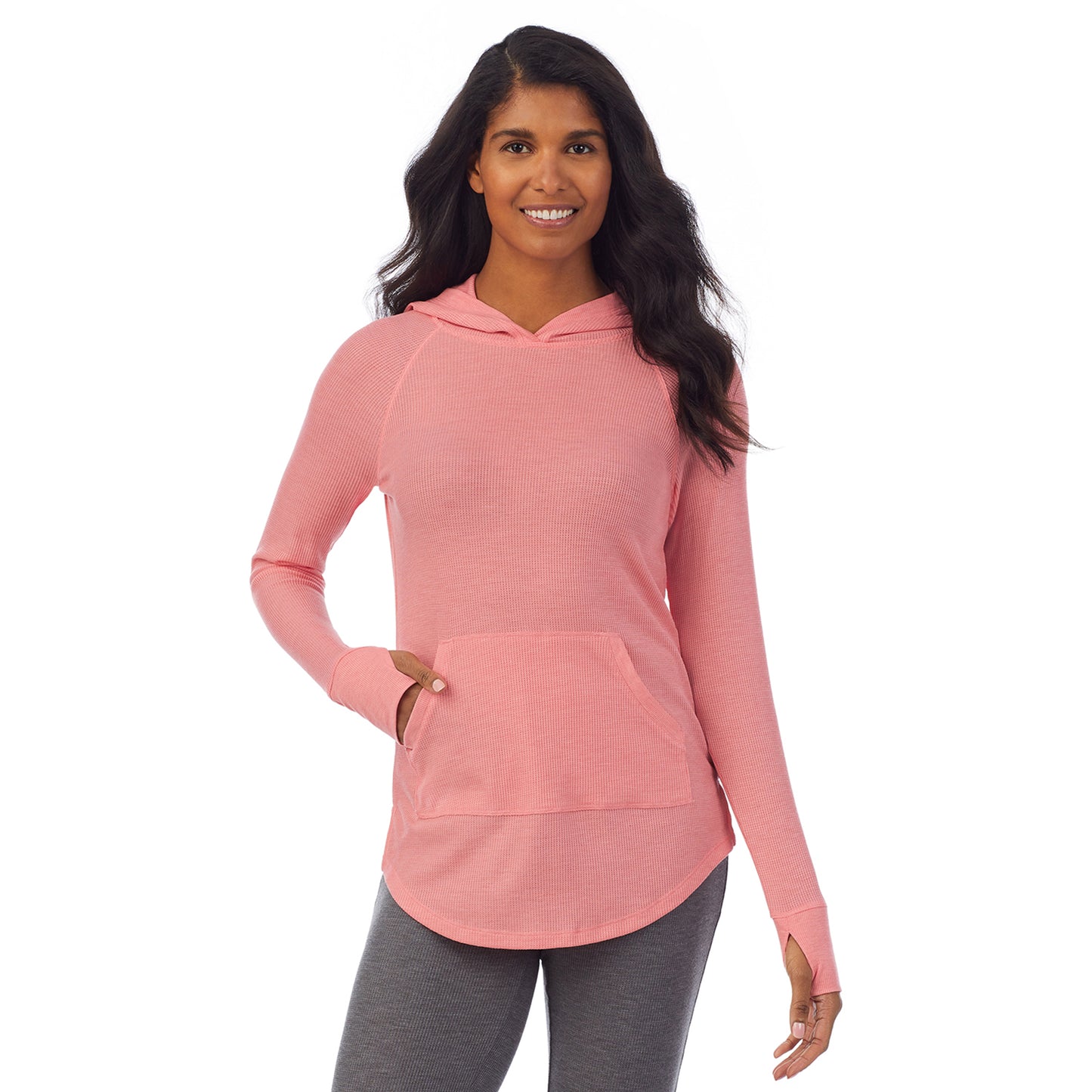 Bright Coral Heather; Model is wearing size S. She is 5’10”, Bust 34”, Waist 24”, Hips 34”. @A lady wearing a bright coral heather long sleeve hoodie tunic.