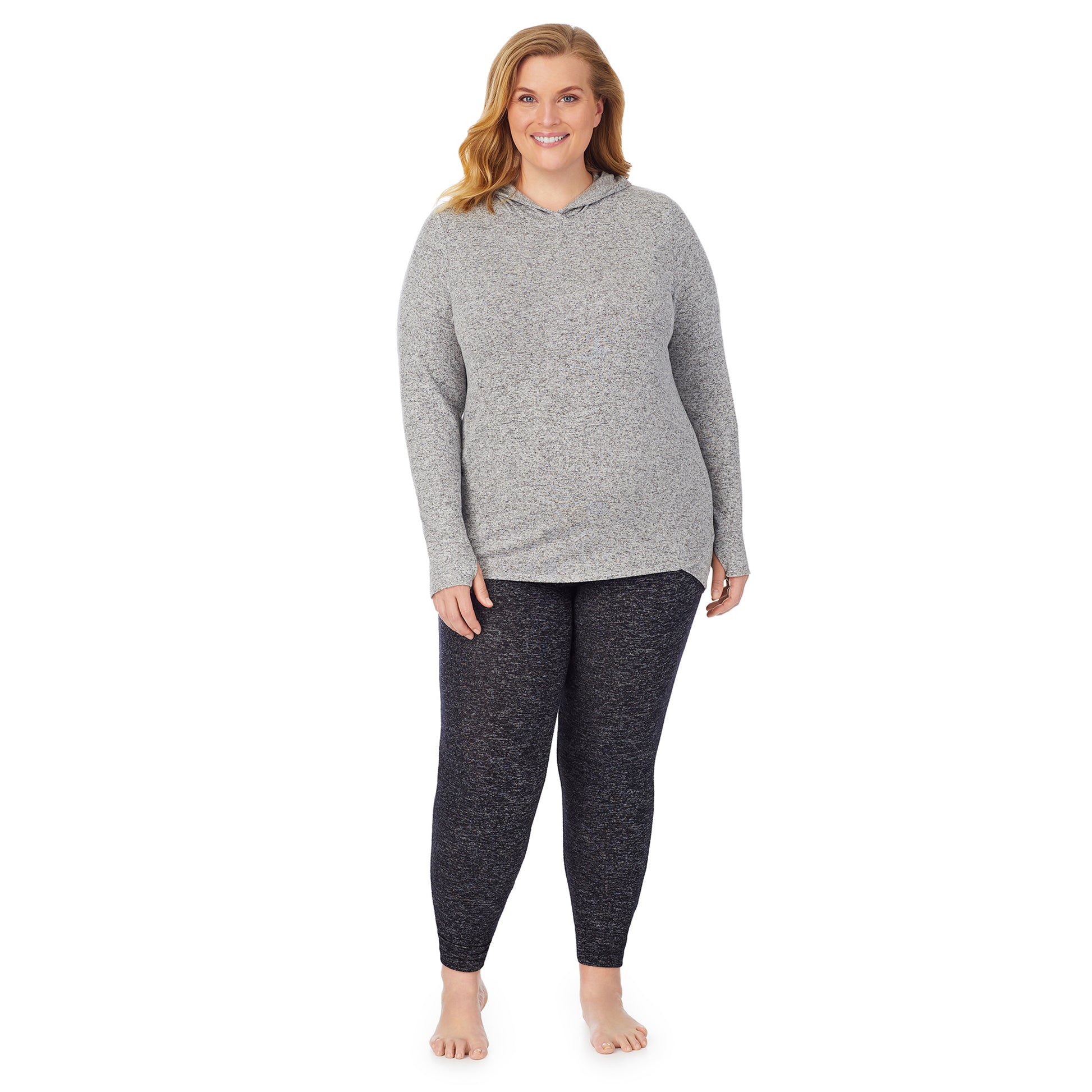 A lady wearing a marled grey long sleeve tunic hoodie plus.