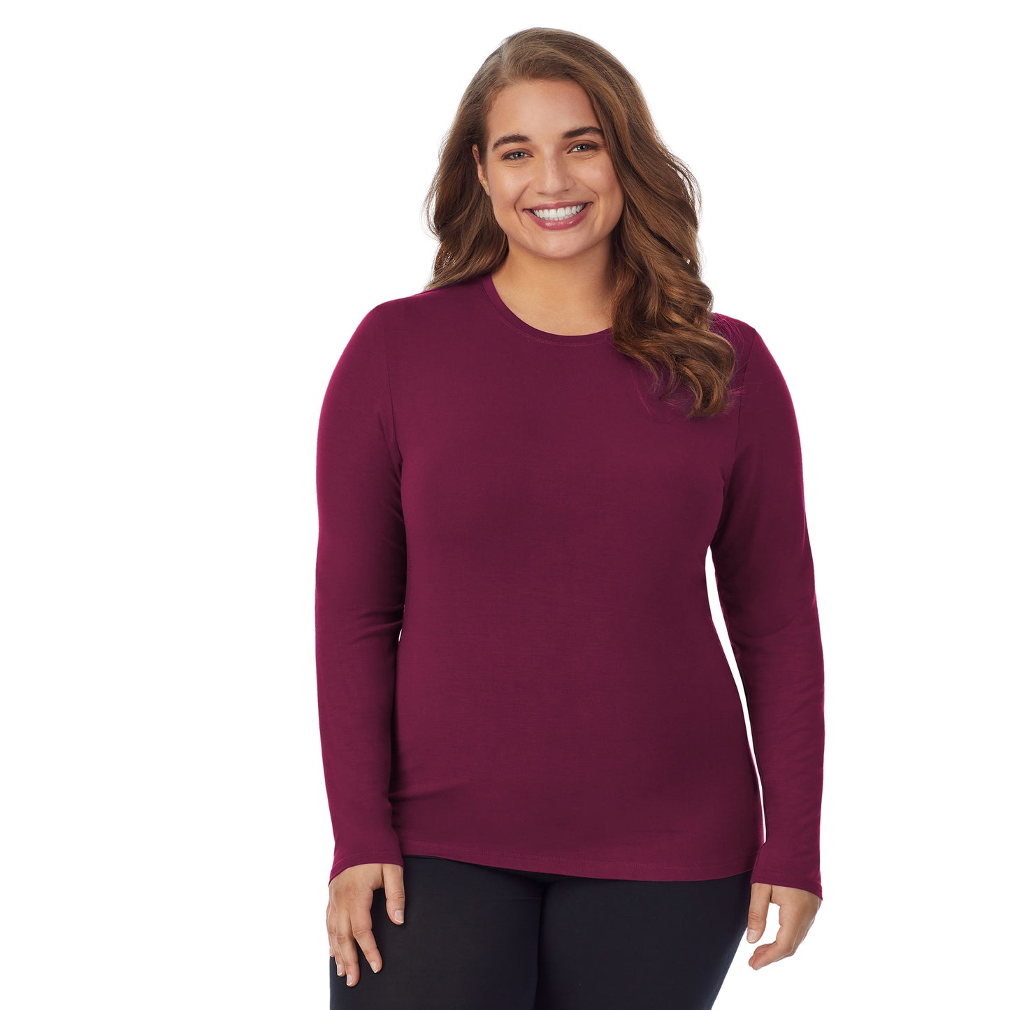 Grape; Model is wearing size 1X. She is 5'7", Bust 42.5", Waist 34.5", Hips 46". @A lady wearing a grape long sleeve stretch crew plus.