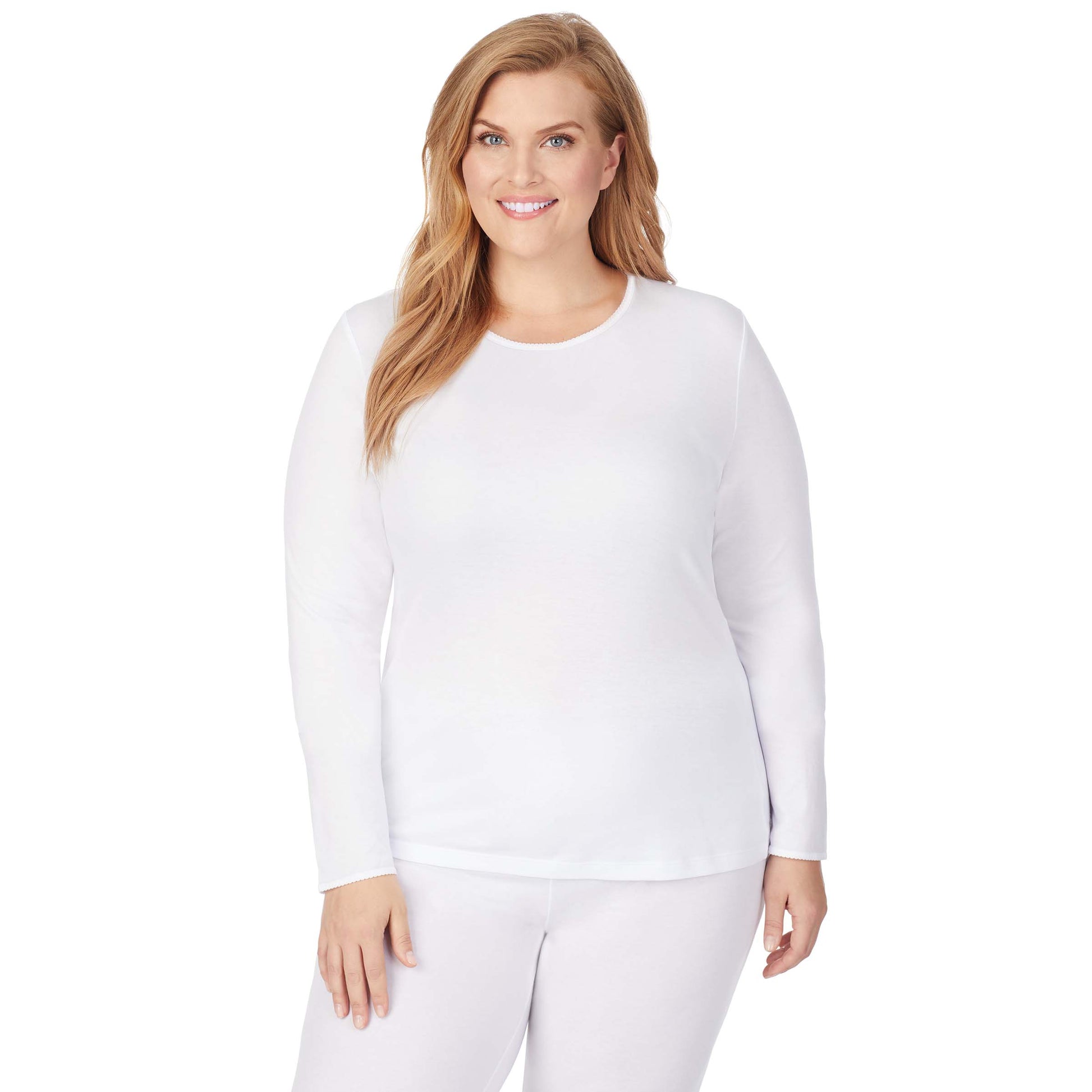 A lady wearing a white long sleeve crew plus.