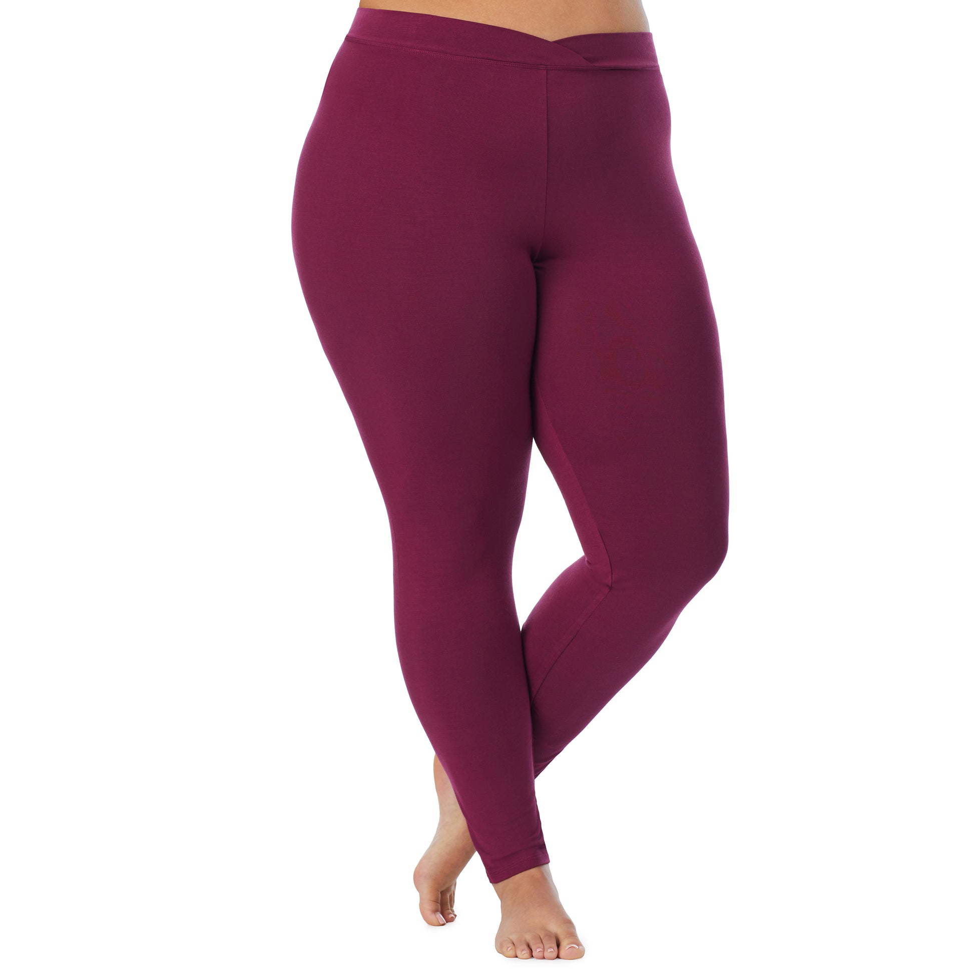A lady wearing a grape stretch legging plus.
