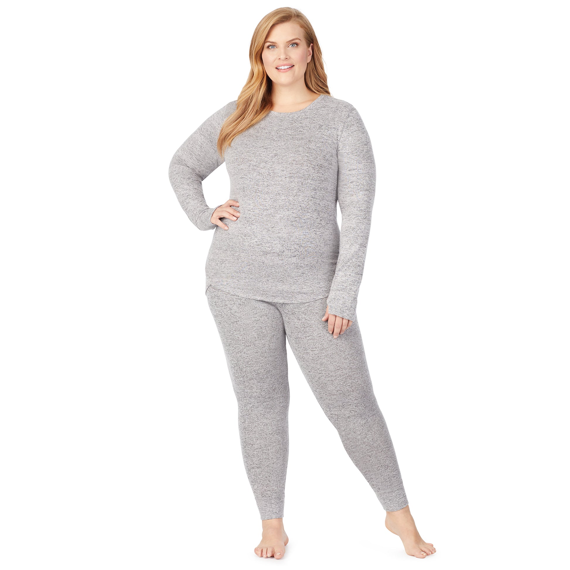 A lady wearing a marled grey legging plus.