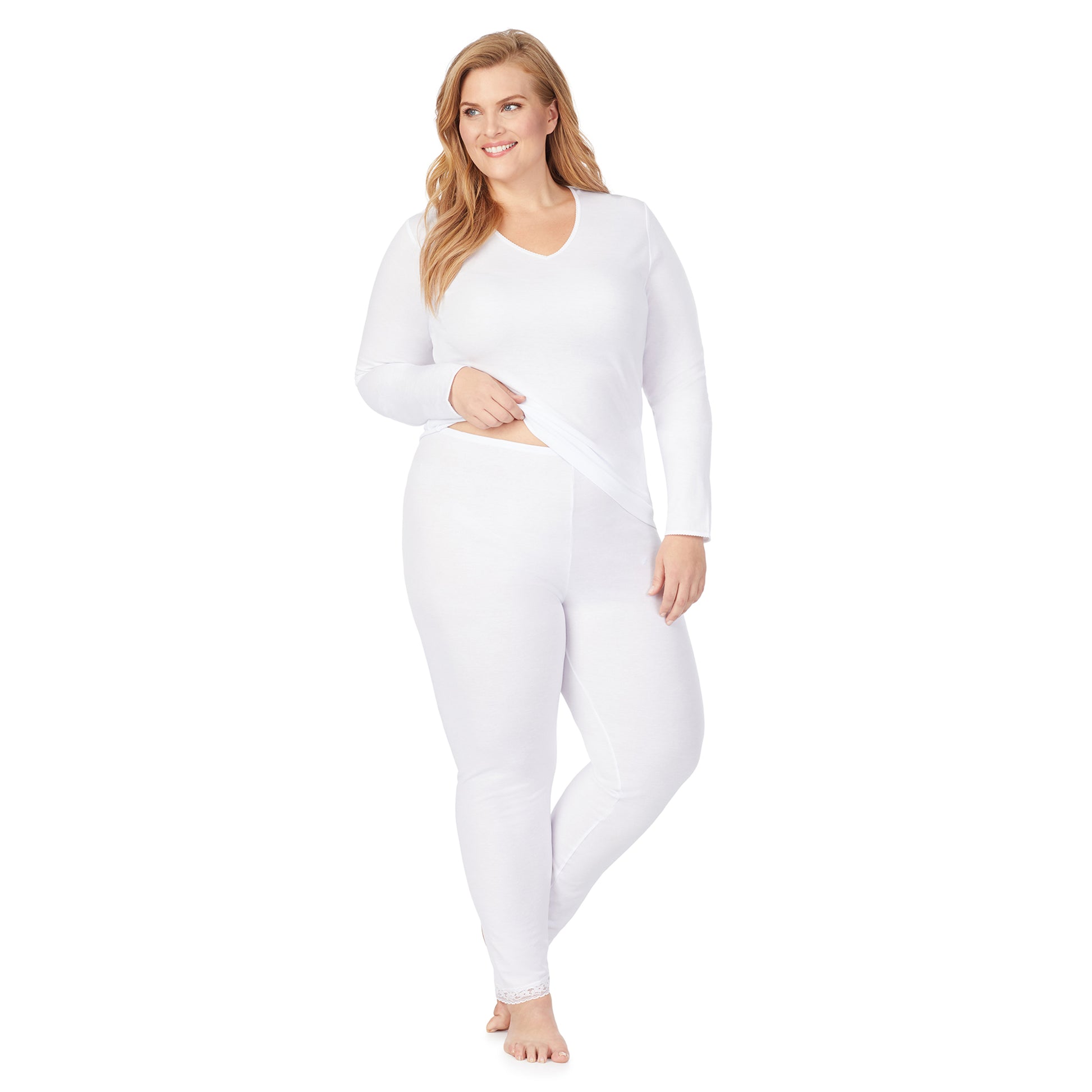 A lady wearing a white lace edge legging plus.