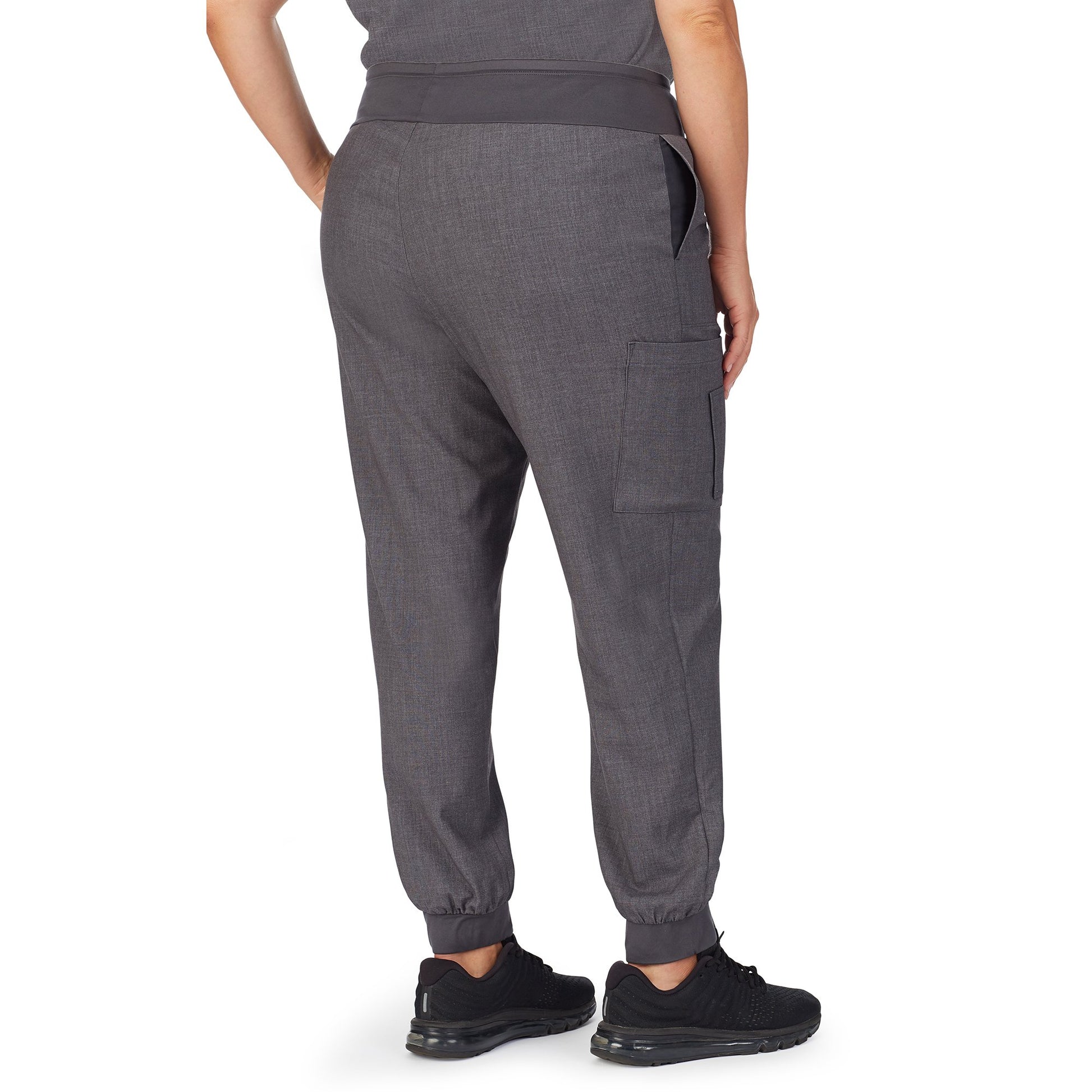 Charcoal Heather;Model is wearing size 1X. She is 5’9.5”, Bust 43”, Waist 37”, Hips 49.5”.@A lady wearing charcoal heather scrub jogger pant plus.