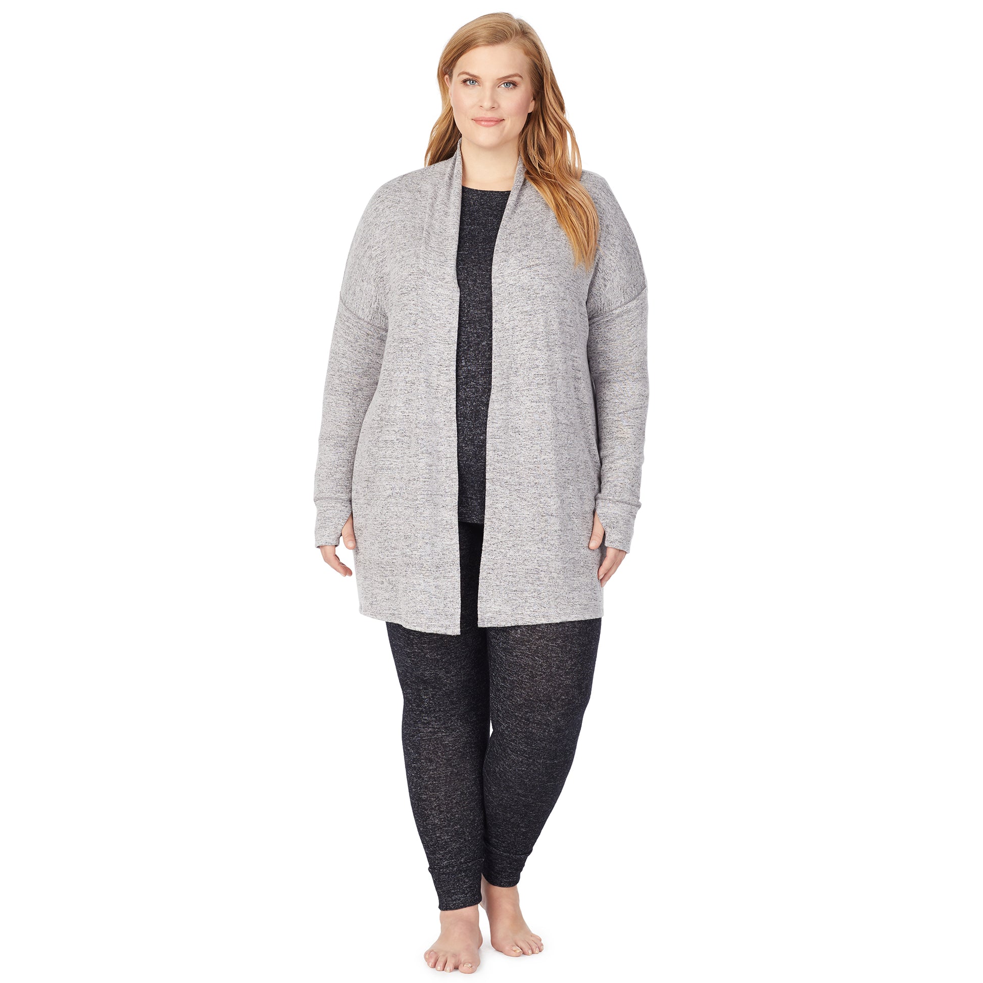 A lady wearing a marled grey long sleeve wrap plus.
