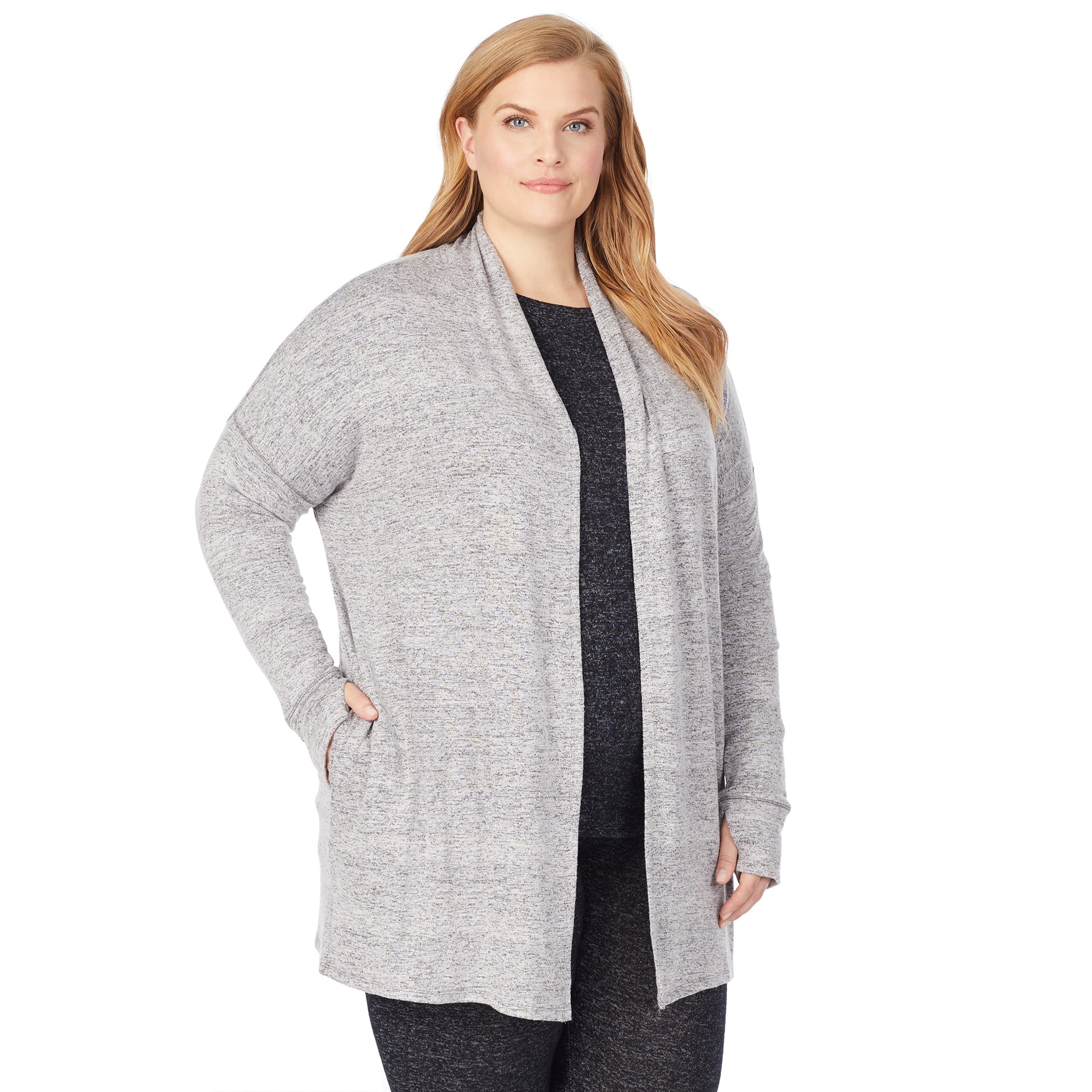 A lady wearing a marled grey long sleeve wrap plus.