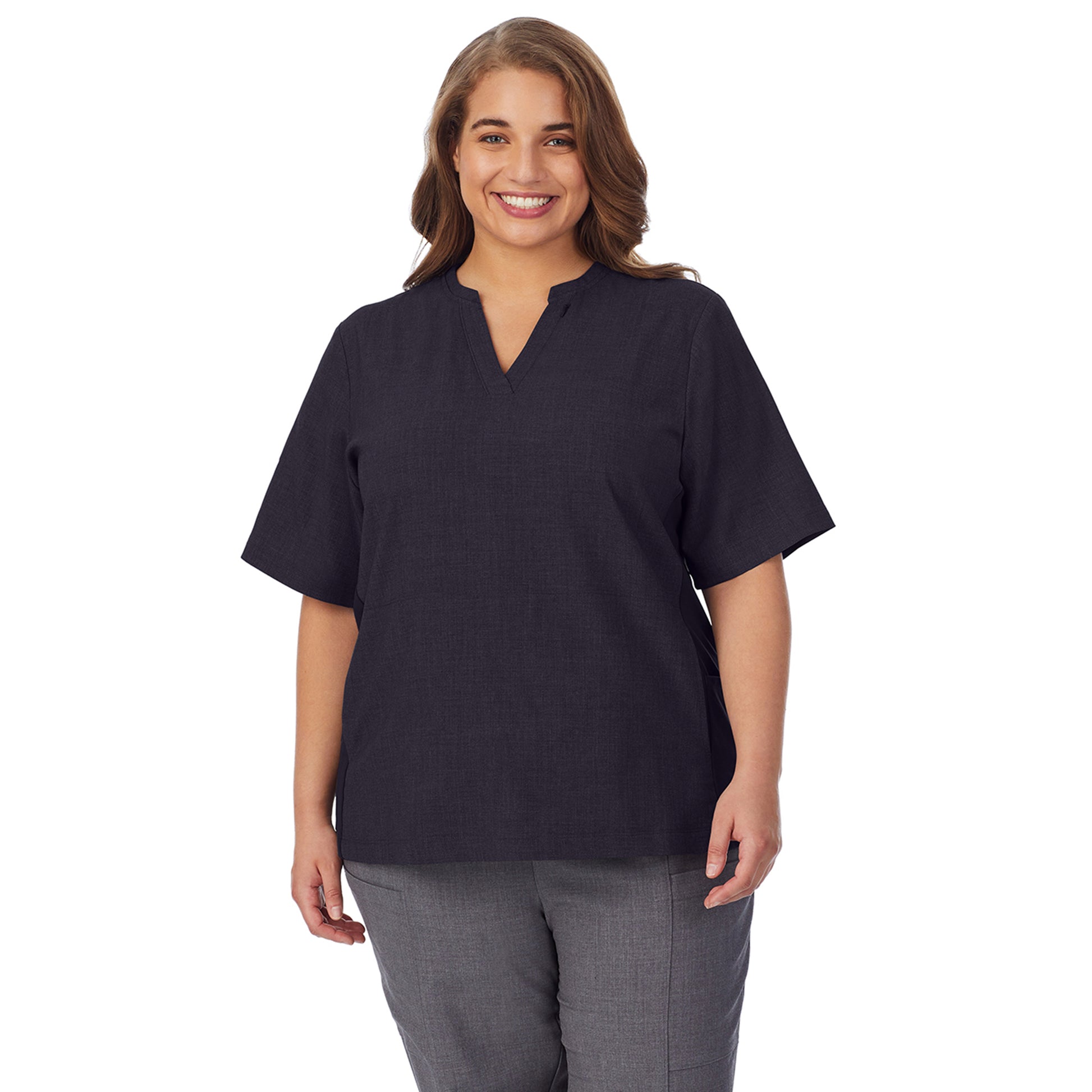 A lady wearing black scrub split neck top plus.